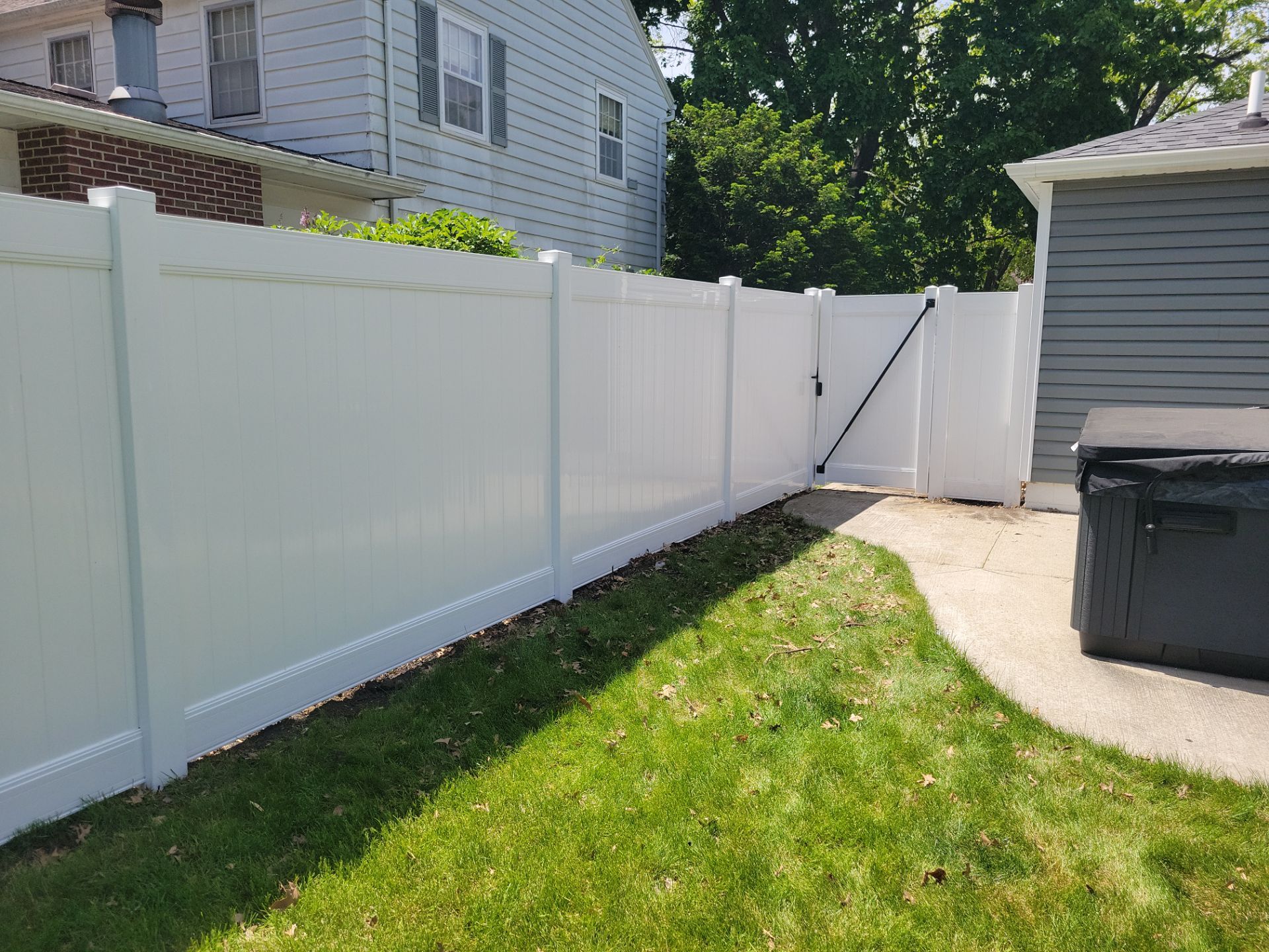 Residential White Vinyl Privacy Fence Installation in Waterloo by Perfect Picket Fence and Stain
