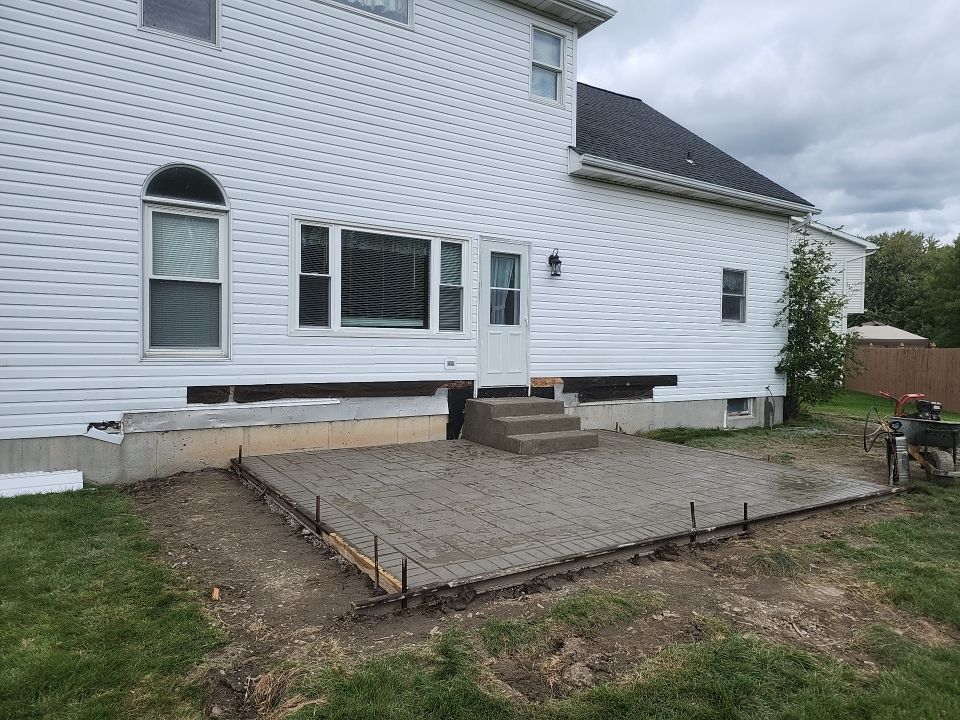 Stamped Concrete and Entry Door by Ivy Lea Construction