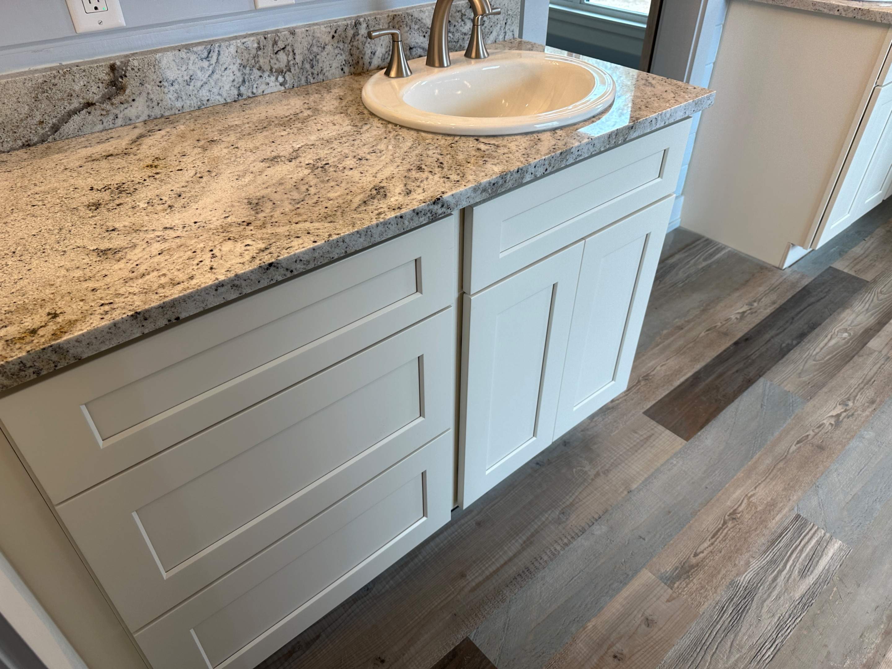 Antique shaker cabinets and granite kitchen and bathroom installation by Mena stone surfaces
