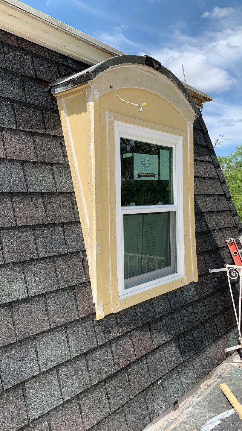 Mansard Charm by Bayfront Roofing and Construction
