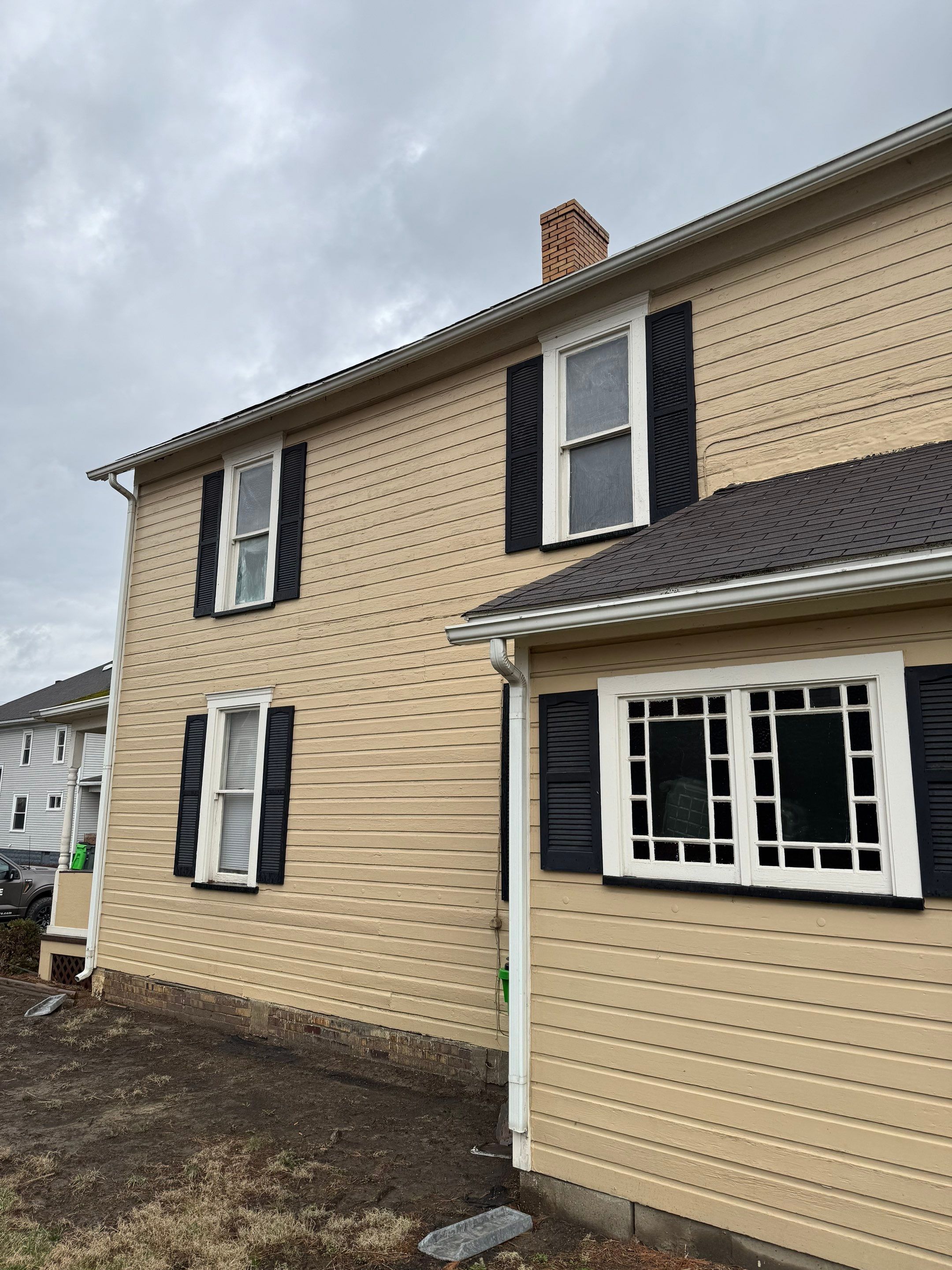 Vinyl Window Replacement and Black Shutter Installation in Dennison by Ohio State Windows