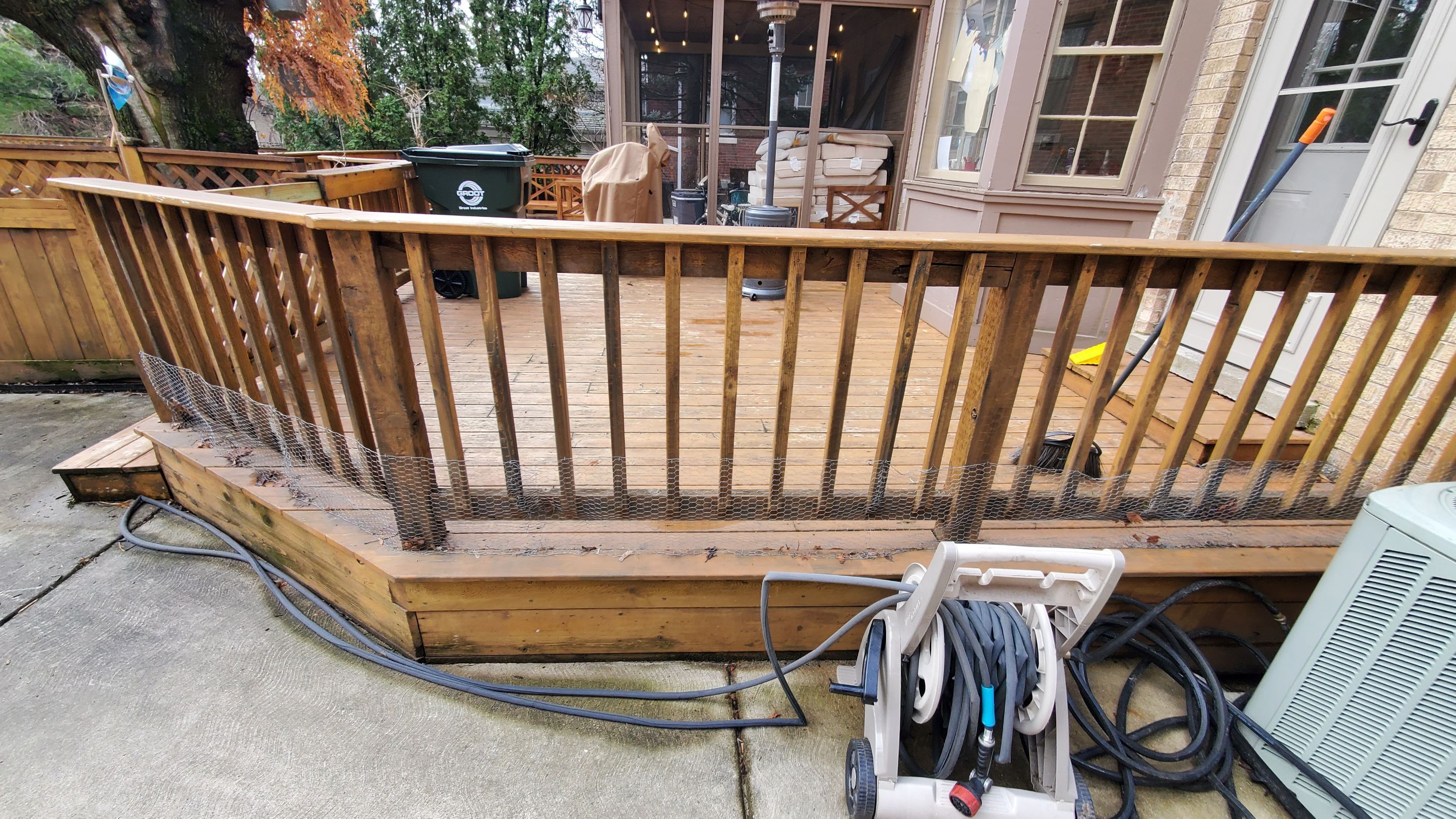 Wood cleaning and staining using Armstrong cloark oil stain by Northern Power Washing LLC.