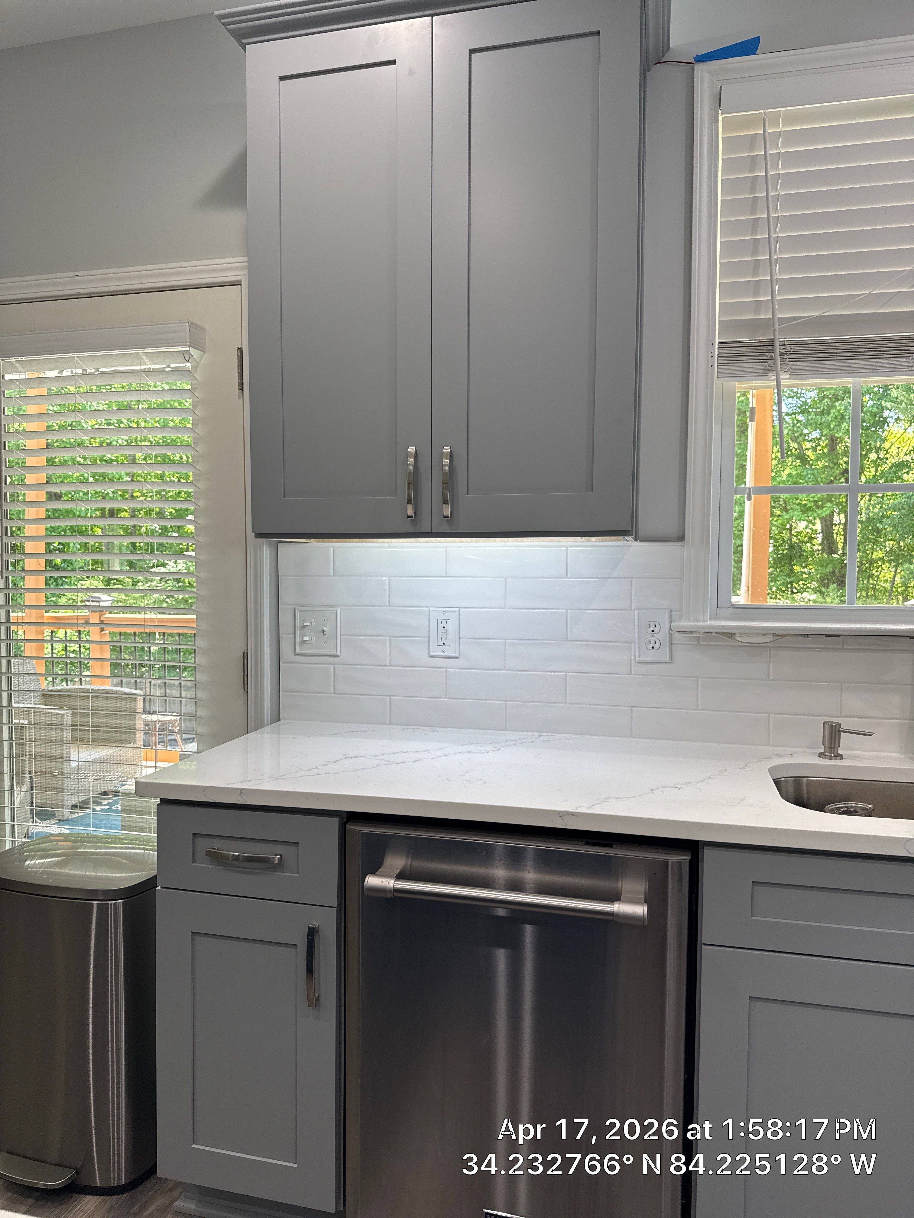 Modern Kitchen Remodel With Grey Shaker Cabinets and Navy Blue Island by Heart & Home Kitchen & Bath Remodeling LLC