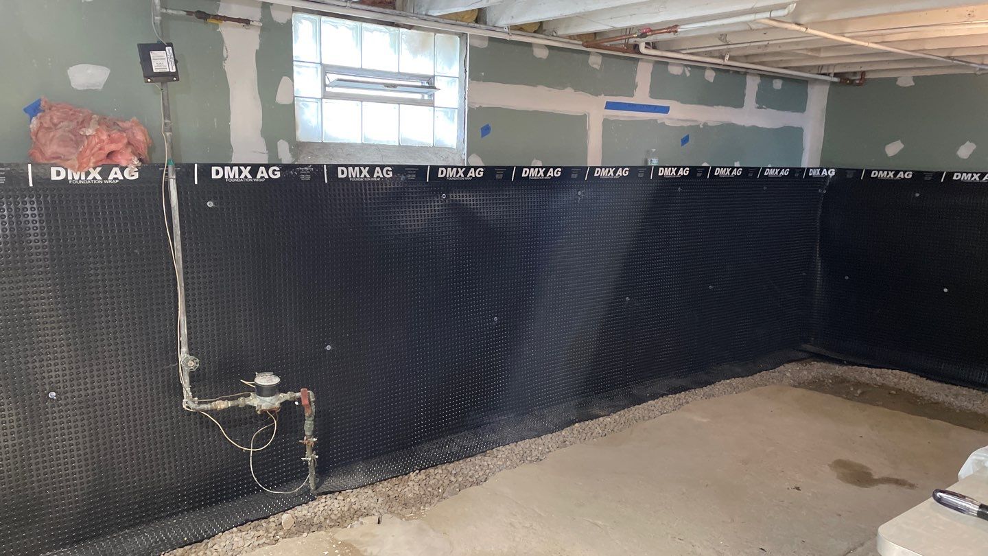 Drain Tile, Window Wells & Buried Discharge in Minneapolis by Waterproofing Northeast
