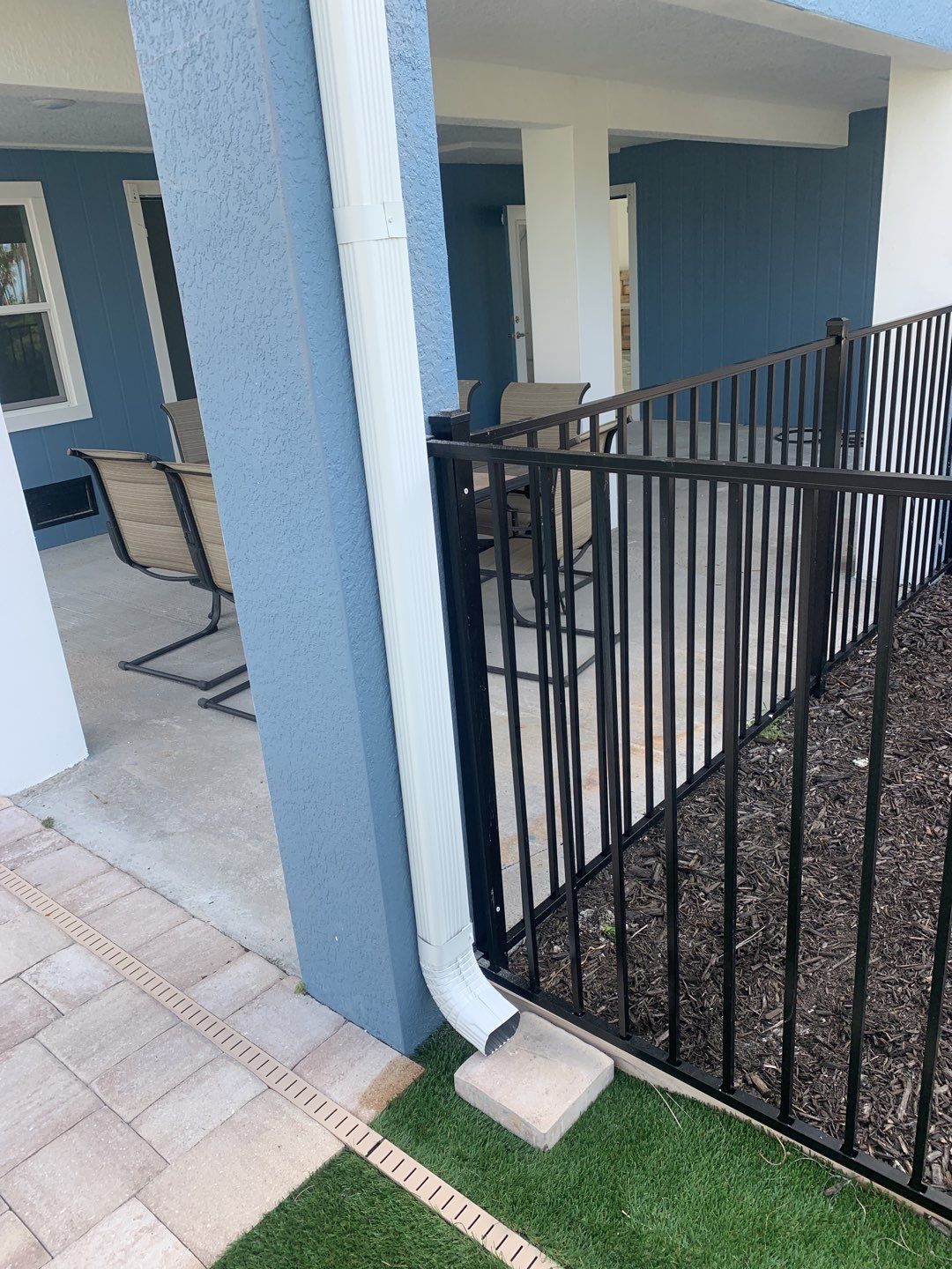 Downspout Installation for Two-Story Home in Fort Myers FL by Gutter Professor by Gutter Professors