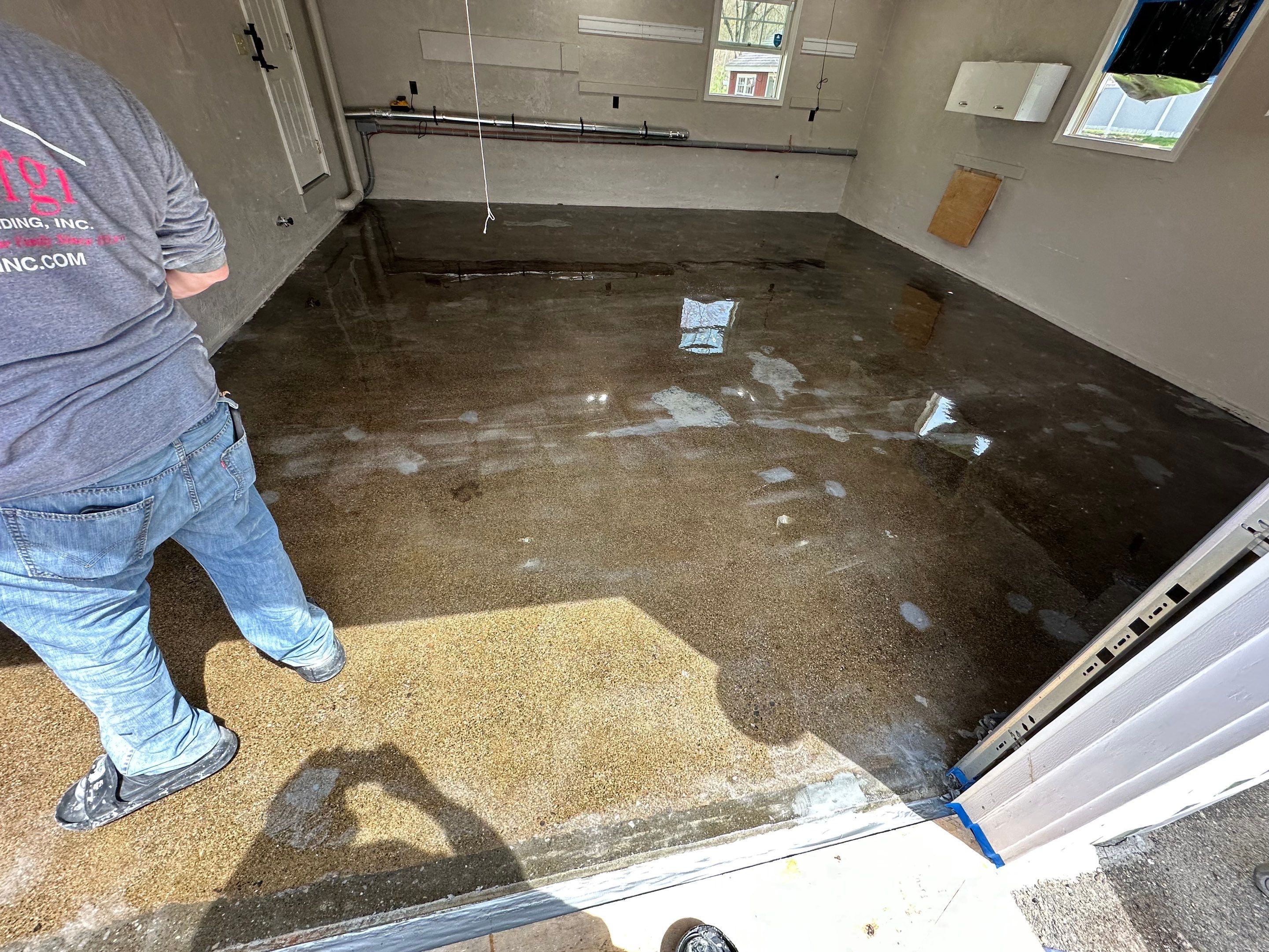Garage Floor Transformation with Durable Concrete Floor Coating by DiGiorgi Roofing and Siding Inc