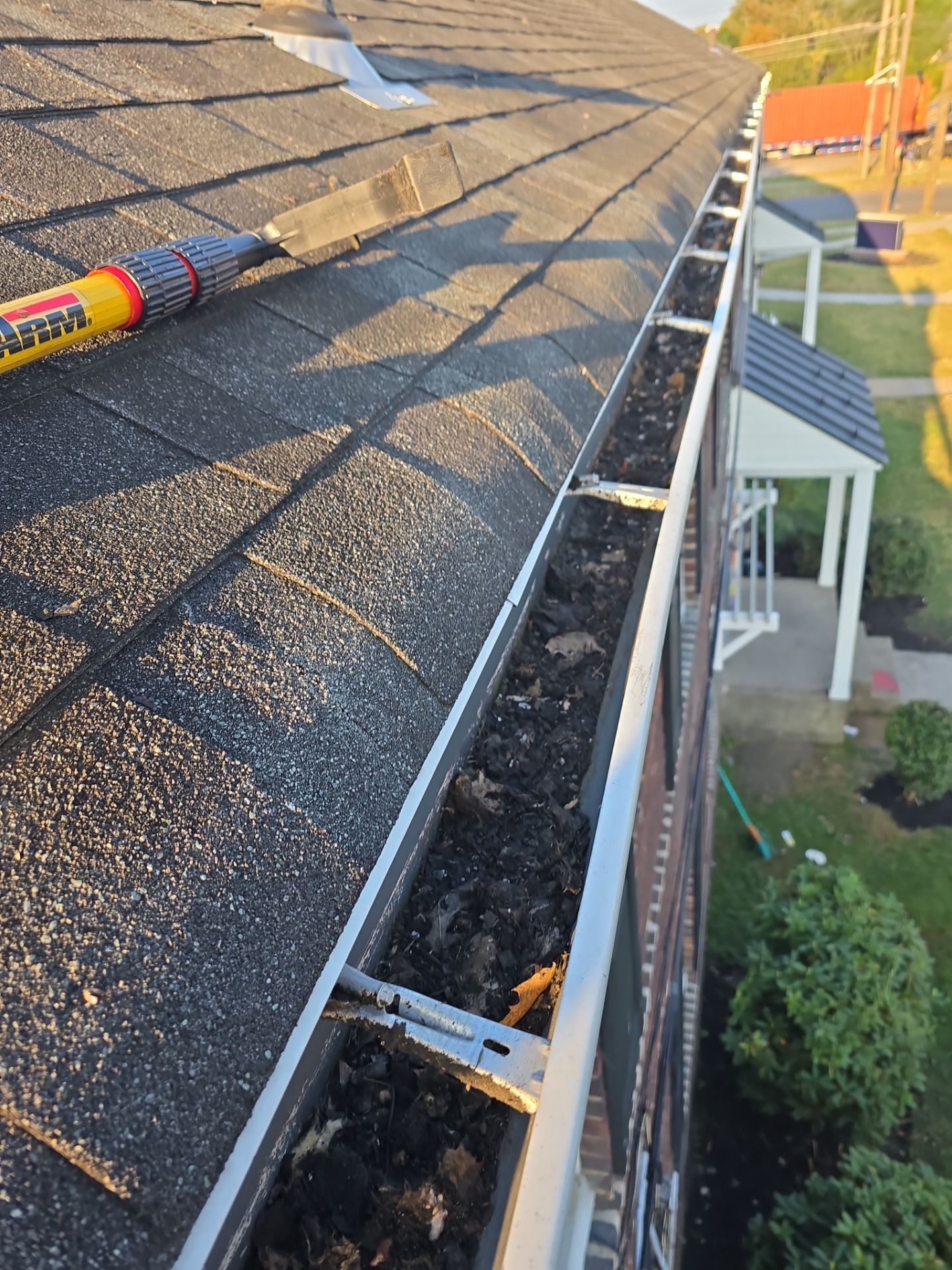 Commercial gutter cleaning New Jersey before photo with filled gutters