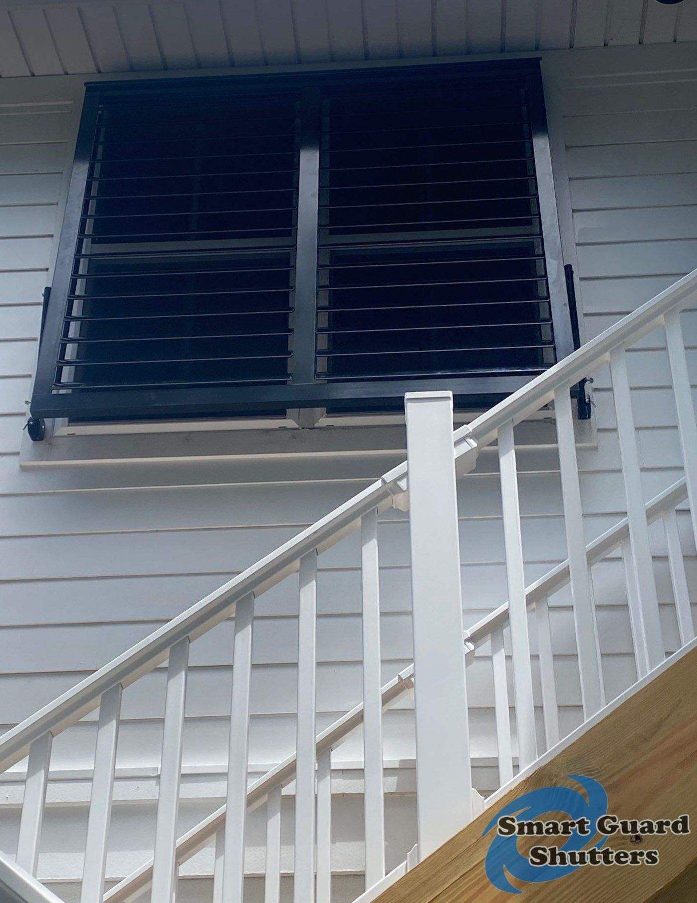 Impact Bahama Shutters in Jet Black by Smart Guard Shutters
