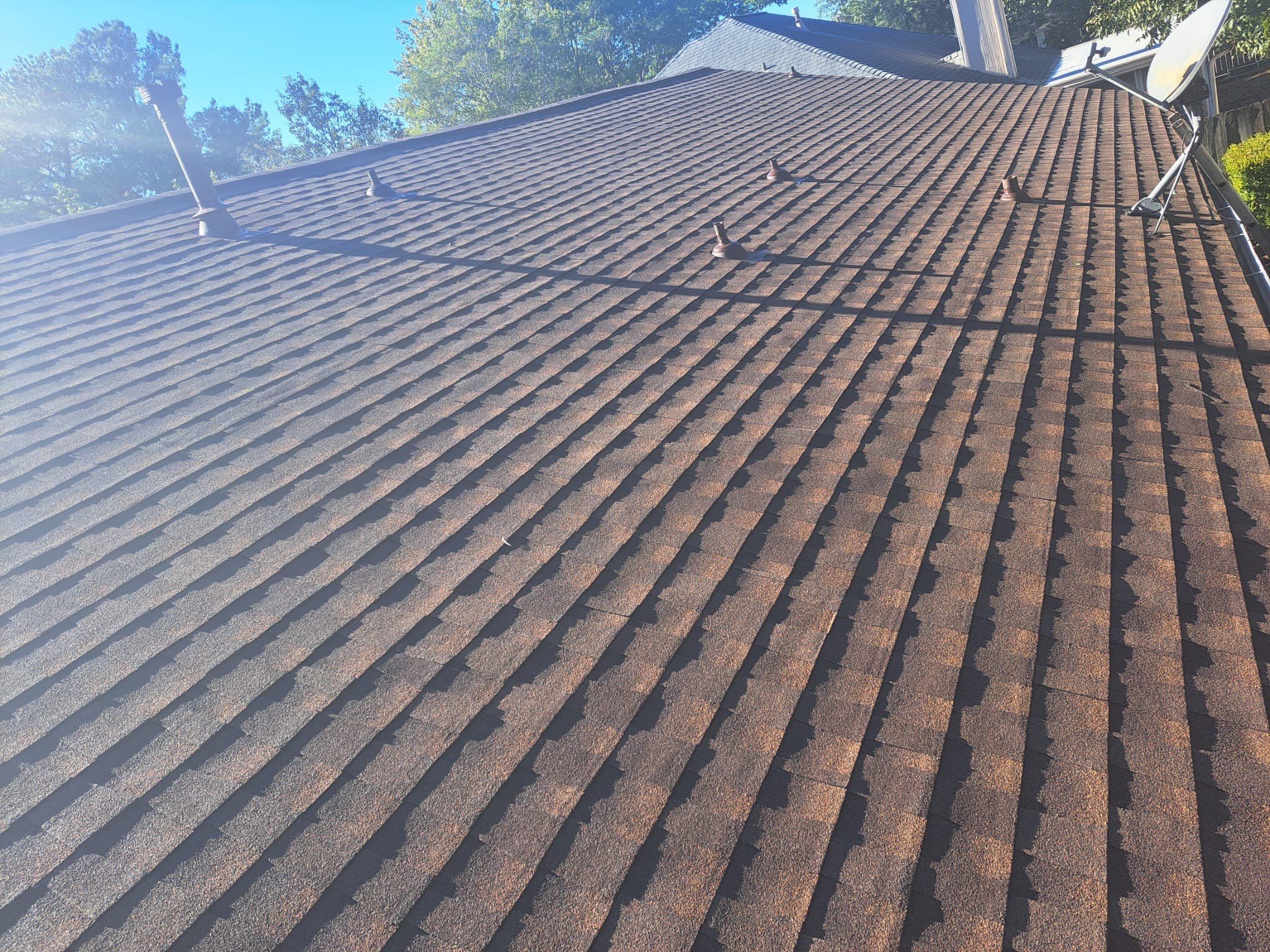 Hail-Marked Roof Replaced in Warm Brown — Houston, TX by PL Roofing & SB Roofing, LLC.