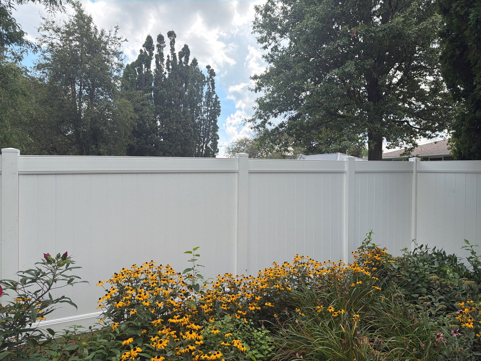 Residential White Vinyl Privacy and Black Chain Link Fencing in Jesup by Perfect Picket Fence and Stain