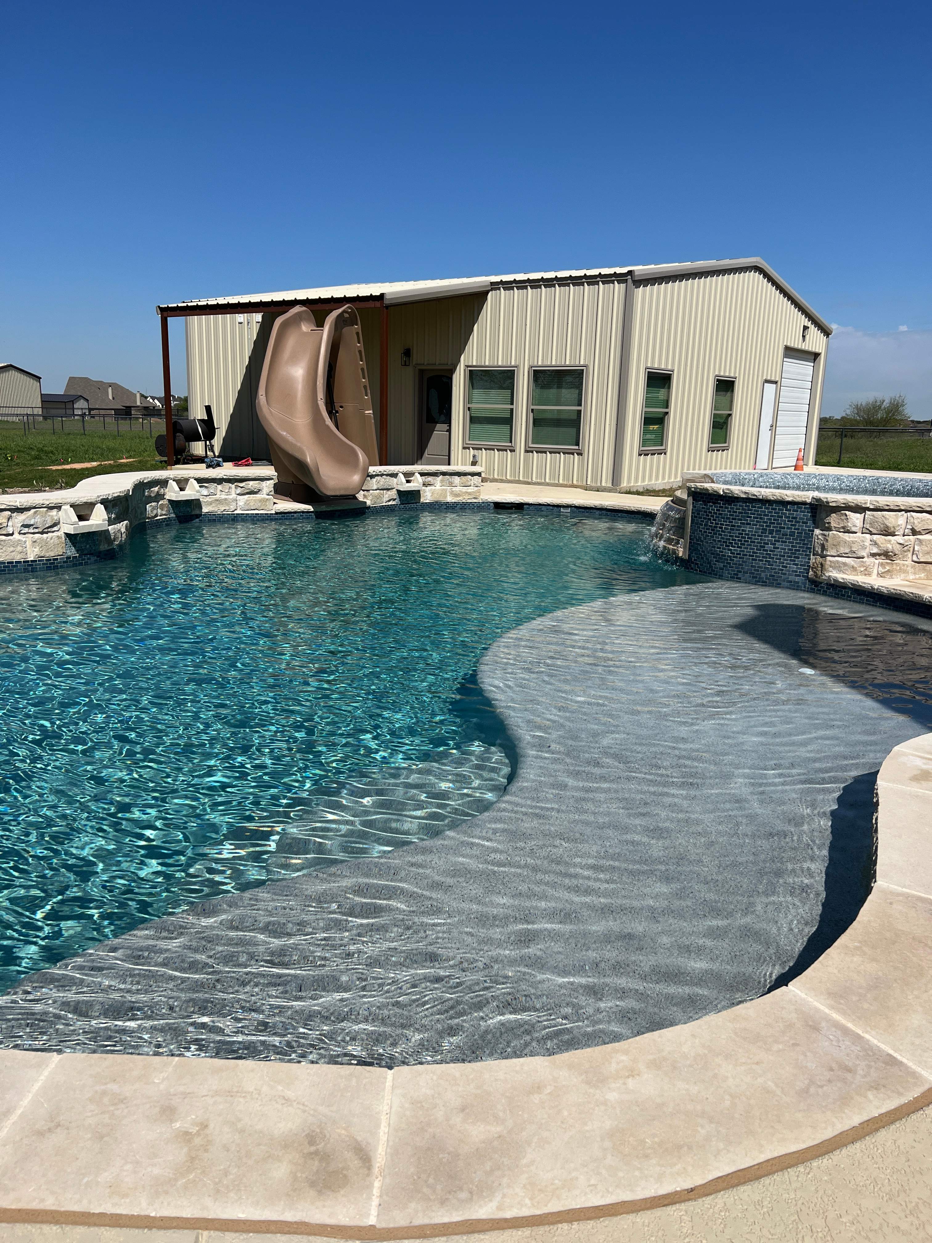 Freeform Pool with Raised Spa and Tanning Ledge by Pinnacle Pools and Spas - DFW