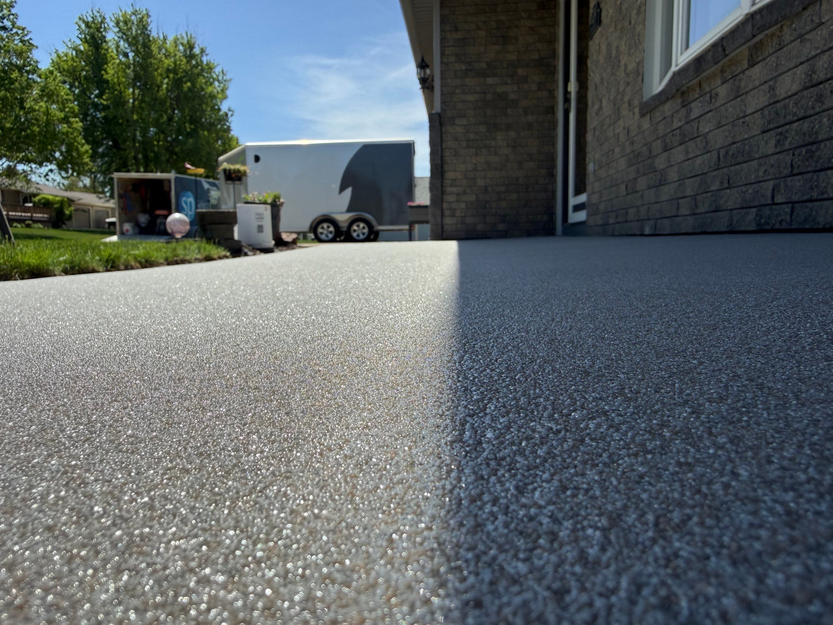 Custom Grey Flake Epoxy Garage Floor Installation in Remsen by Select Painting, Coatings & Garage Cabinets