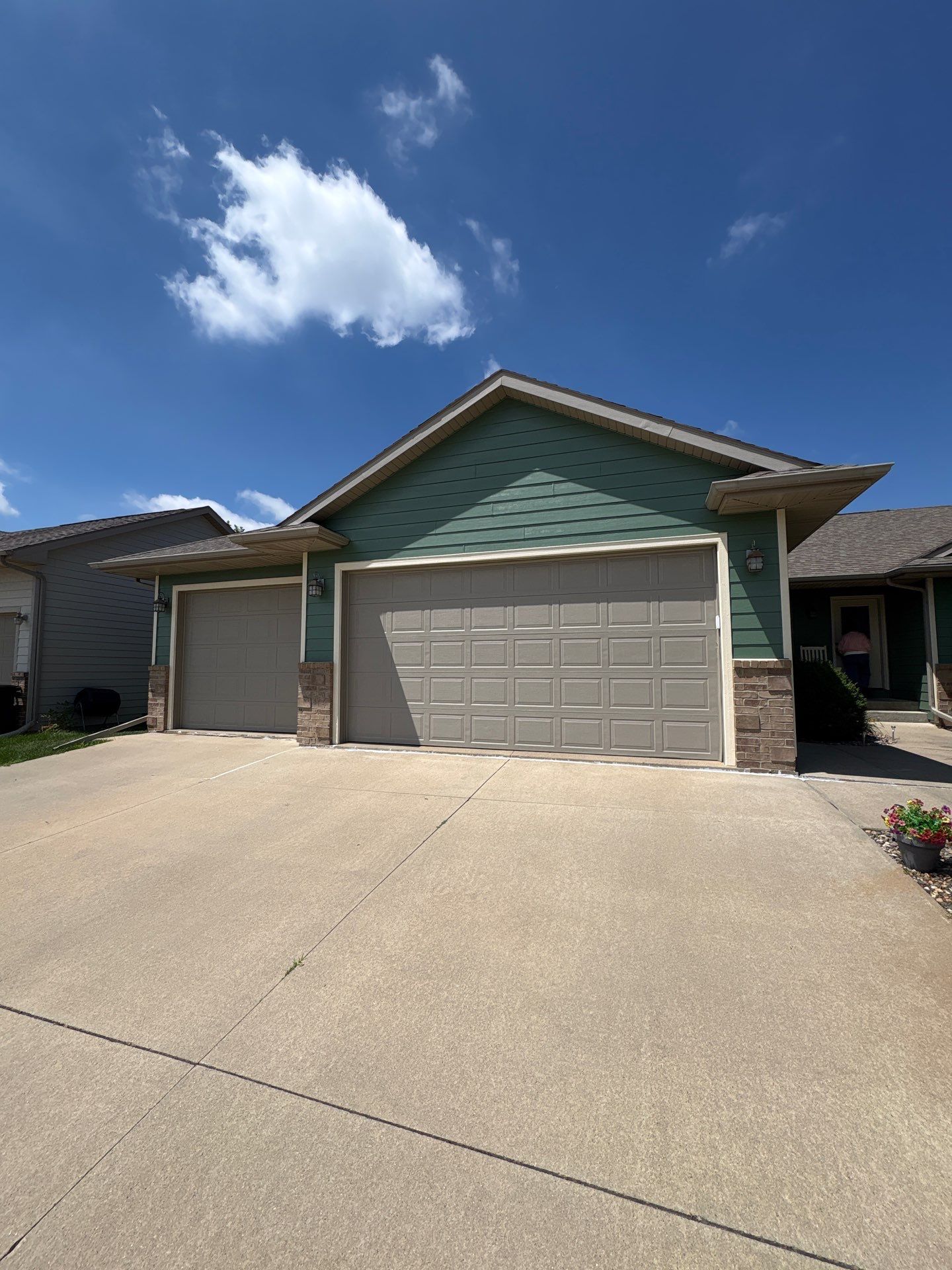 Full Exterior Residential Painting and Siding Refresh in Tea by Select Painting, Coatings & Garage Cabinets