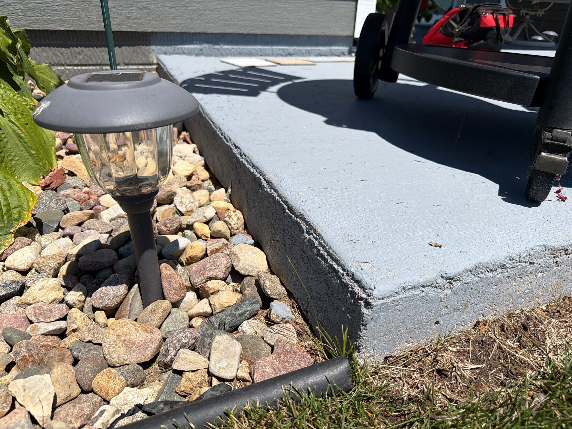 Starry Evening Concrete Patio Coating Installation in Tea by Select Painting, Coatings & Garage Cabinets