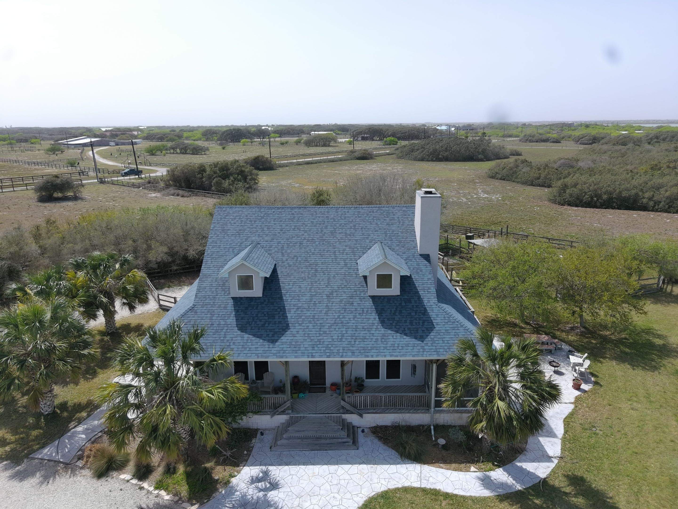 Long Horn Retreat by Bayfront Roofing and Construction