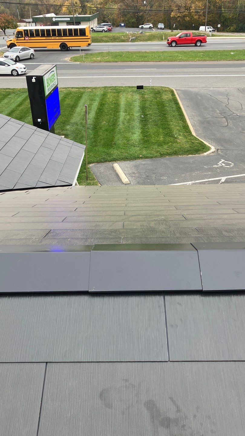 Tesla Solar Roof on a Commercial Building by American Home Contractors