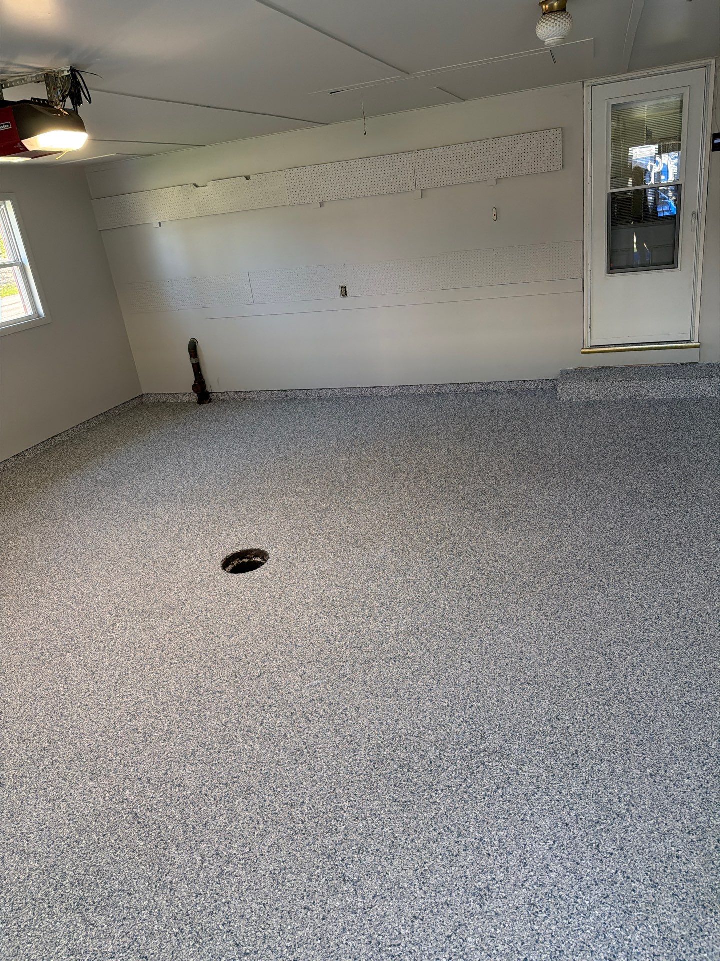 Muskegon Garage Interior Painting and Epoxy Flake Floor Installation by Gordon Painting