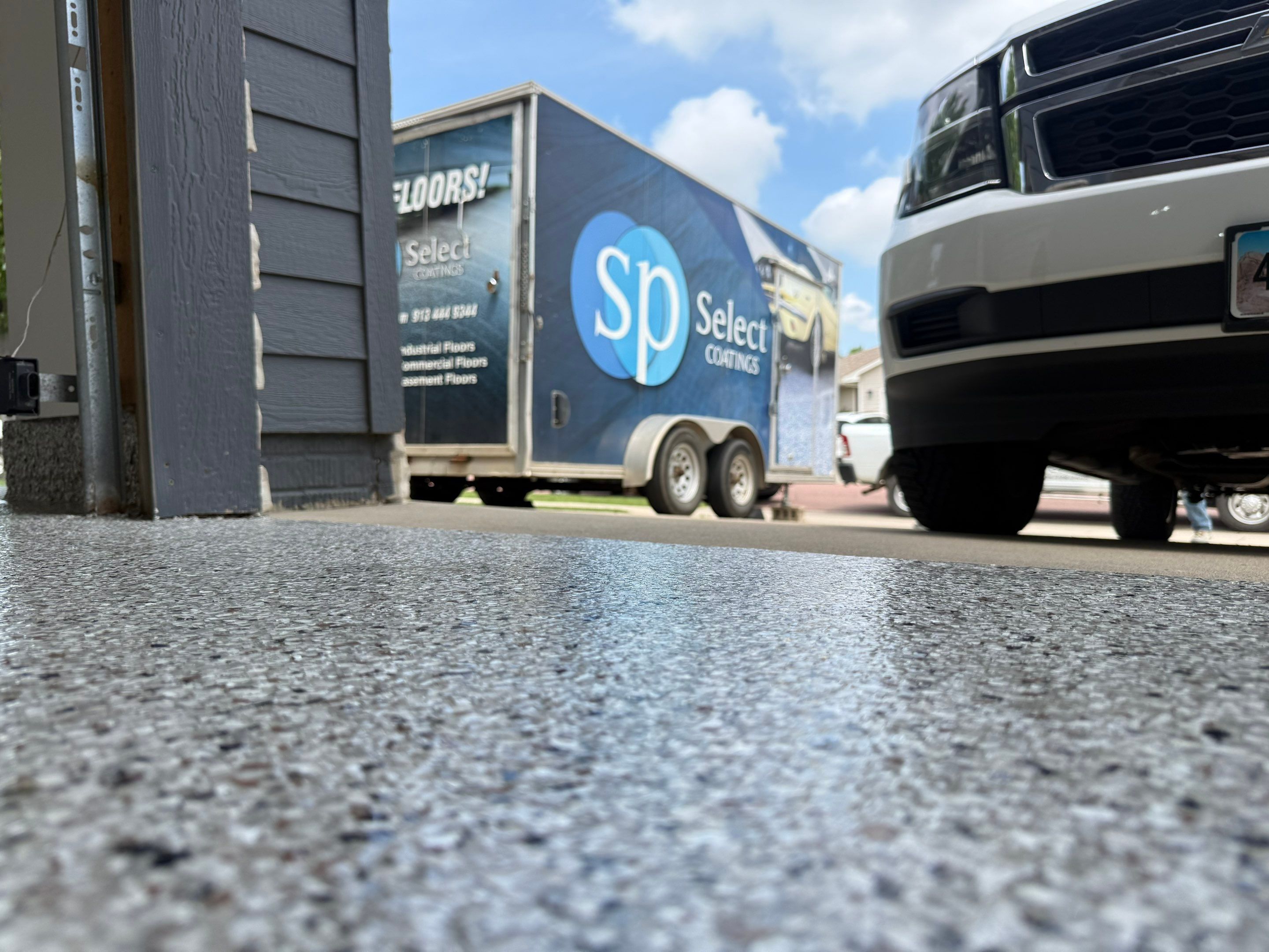 Full Garage Floor Resurfacing and Decorative Epoxy Flake Finish by Select Painting, Coatings & Garage Cabinets