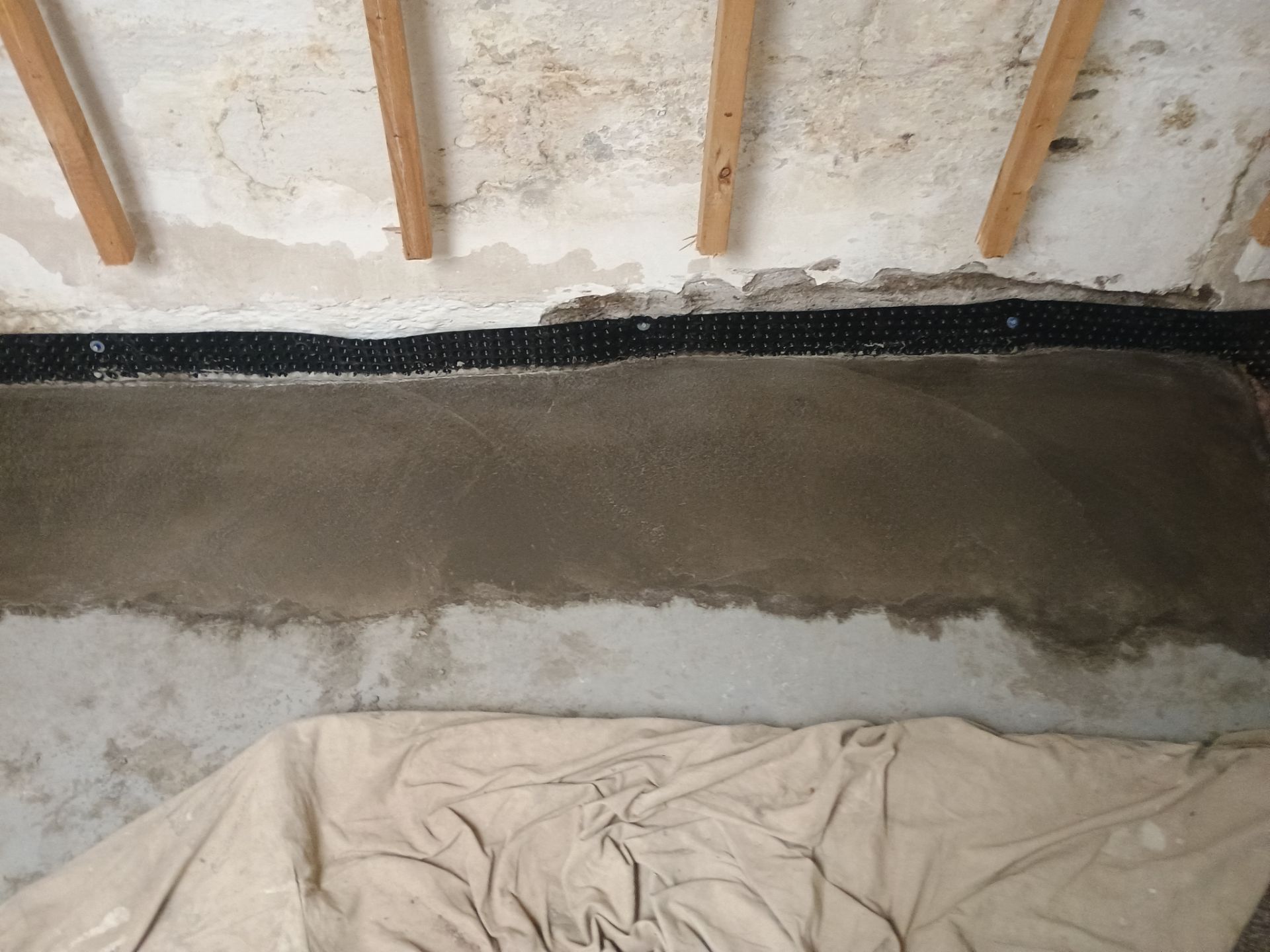 Interior Drain Tile Installation in South Minneapolis by Waterproofing Northeast