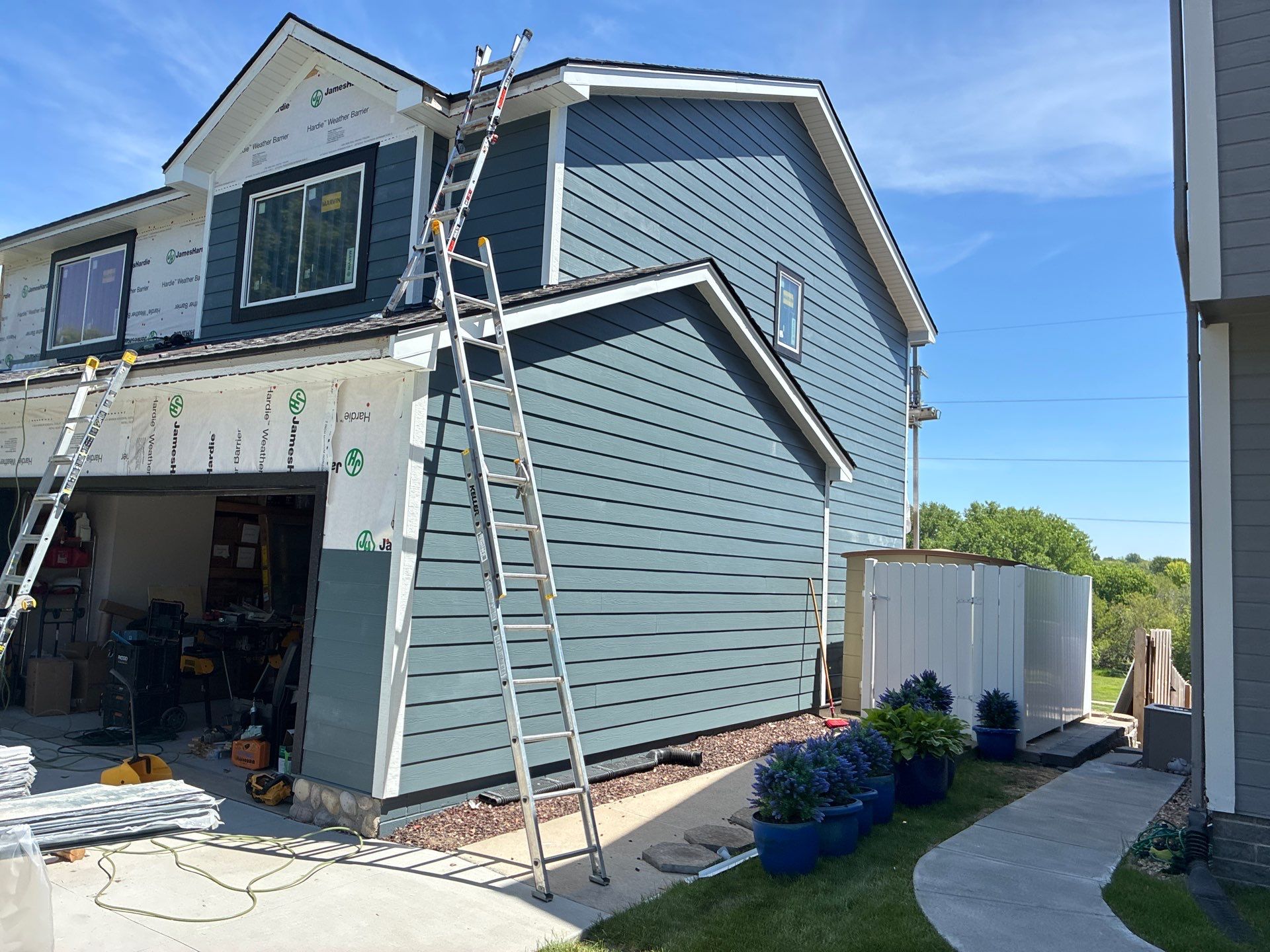 James Hardie Siding and Window Replacement with Arctic White Trim by Carps Complete Exteriors