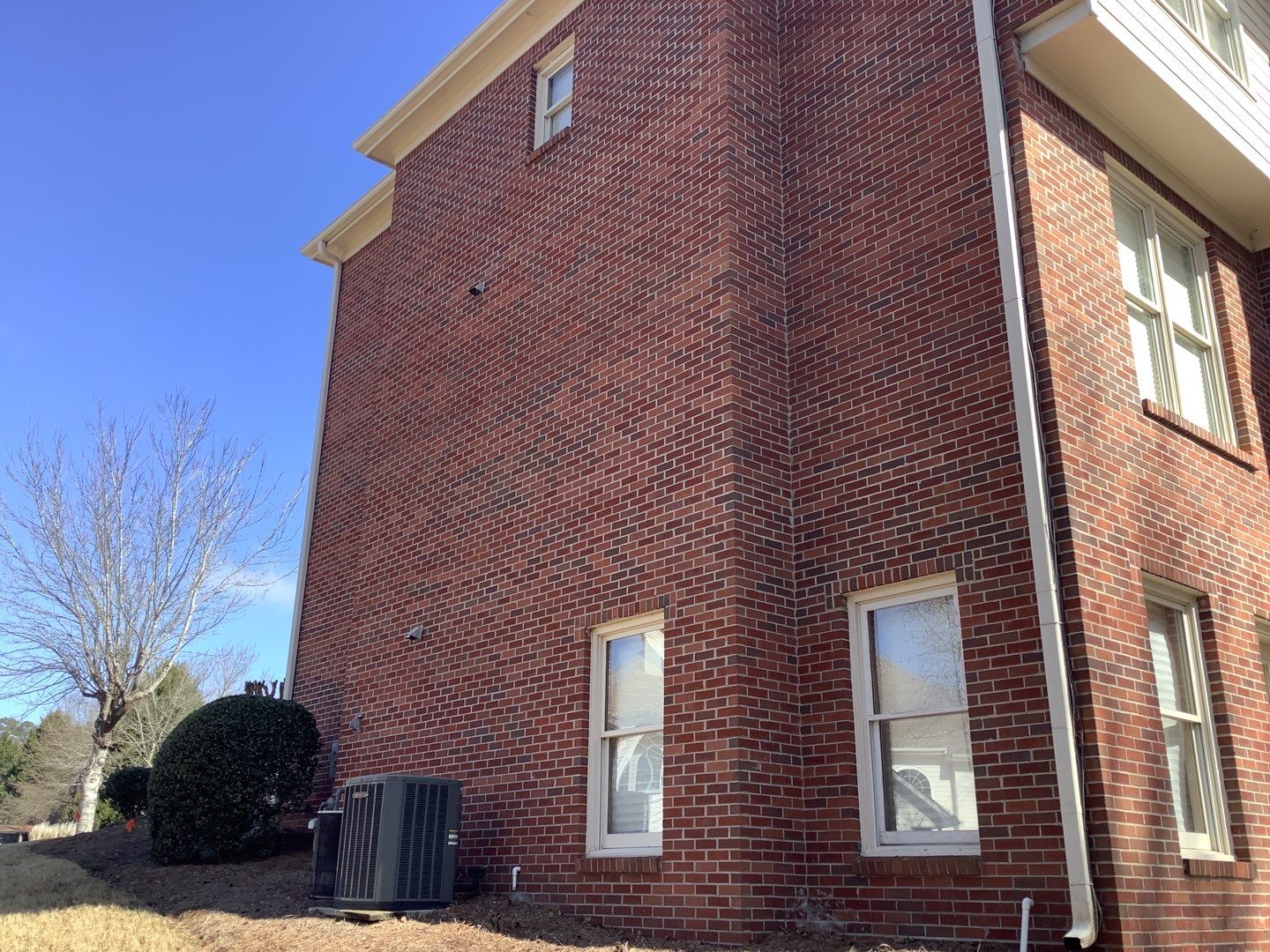 White Brick Exterior Painting and Deck Refinishing in Duluth by Swift Home Renovations
