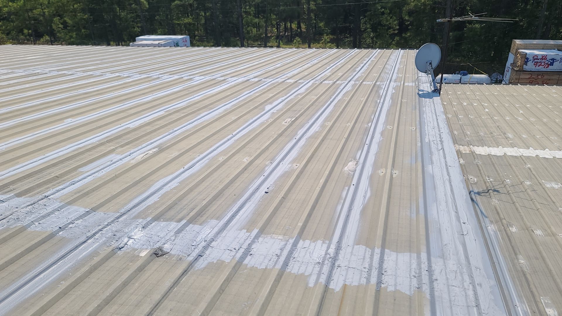 Commercial Roofing Installation using Aldocoat Coatings by Hostetler Roofing