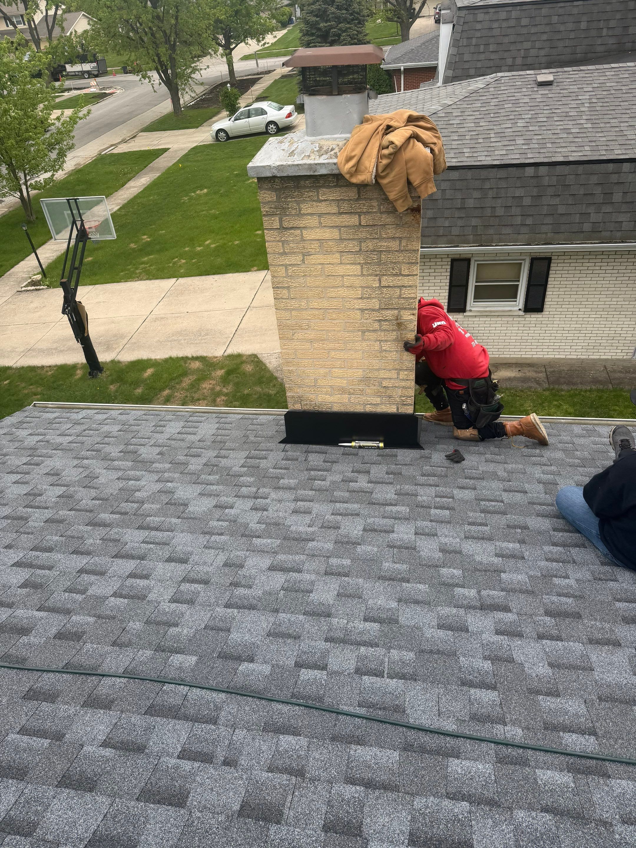 Roof replacement and chimney flashing by Optimal Home Improvement 