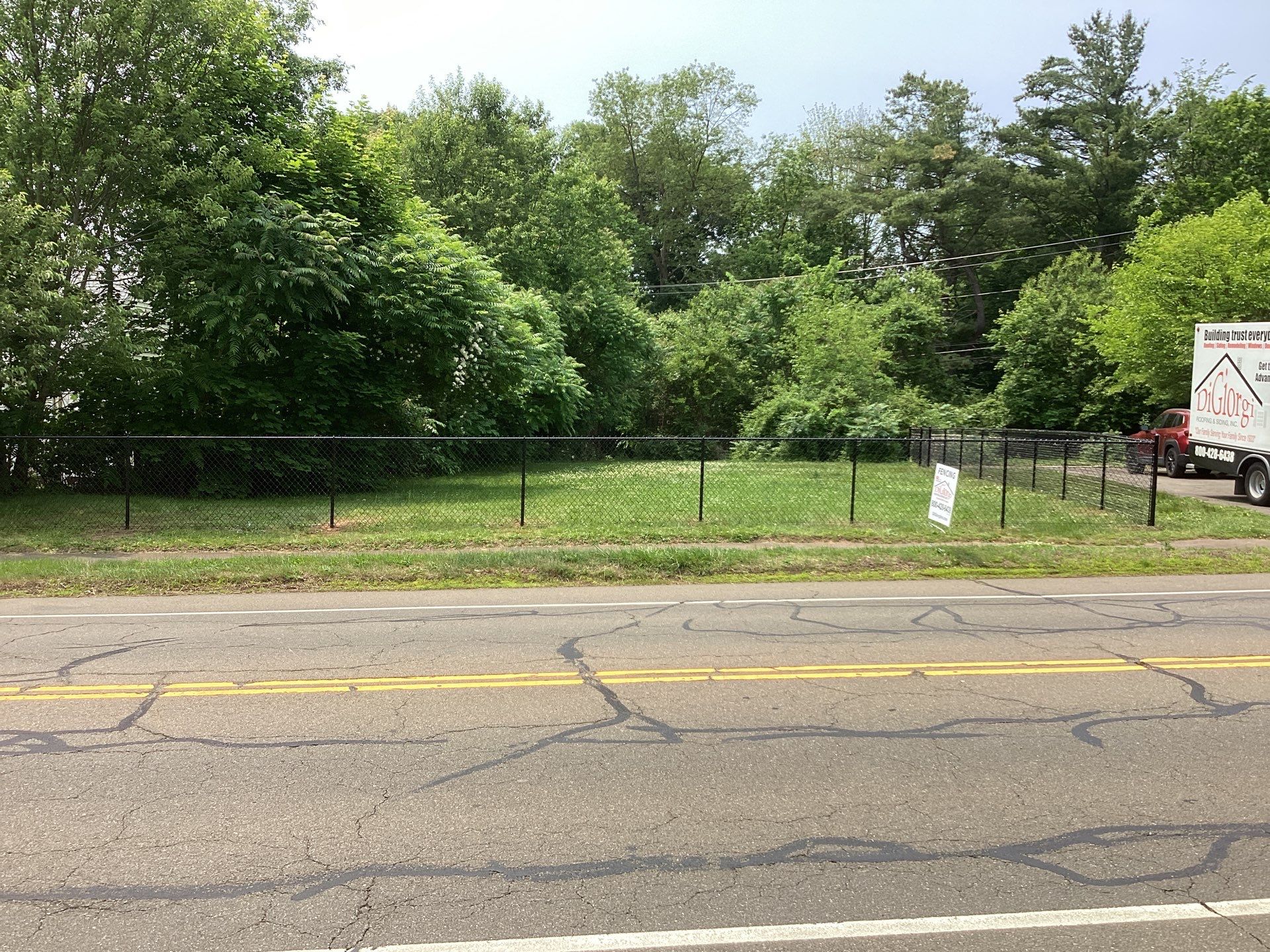 New Black Chain link fence with matching gates  by DiGiorgi Roofing and Siding Inc