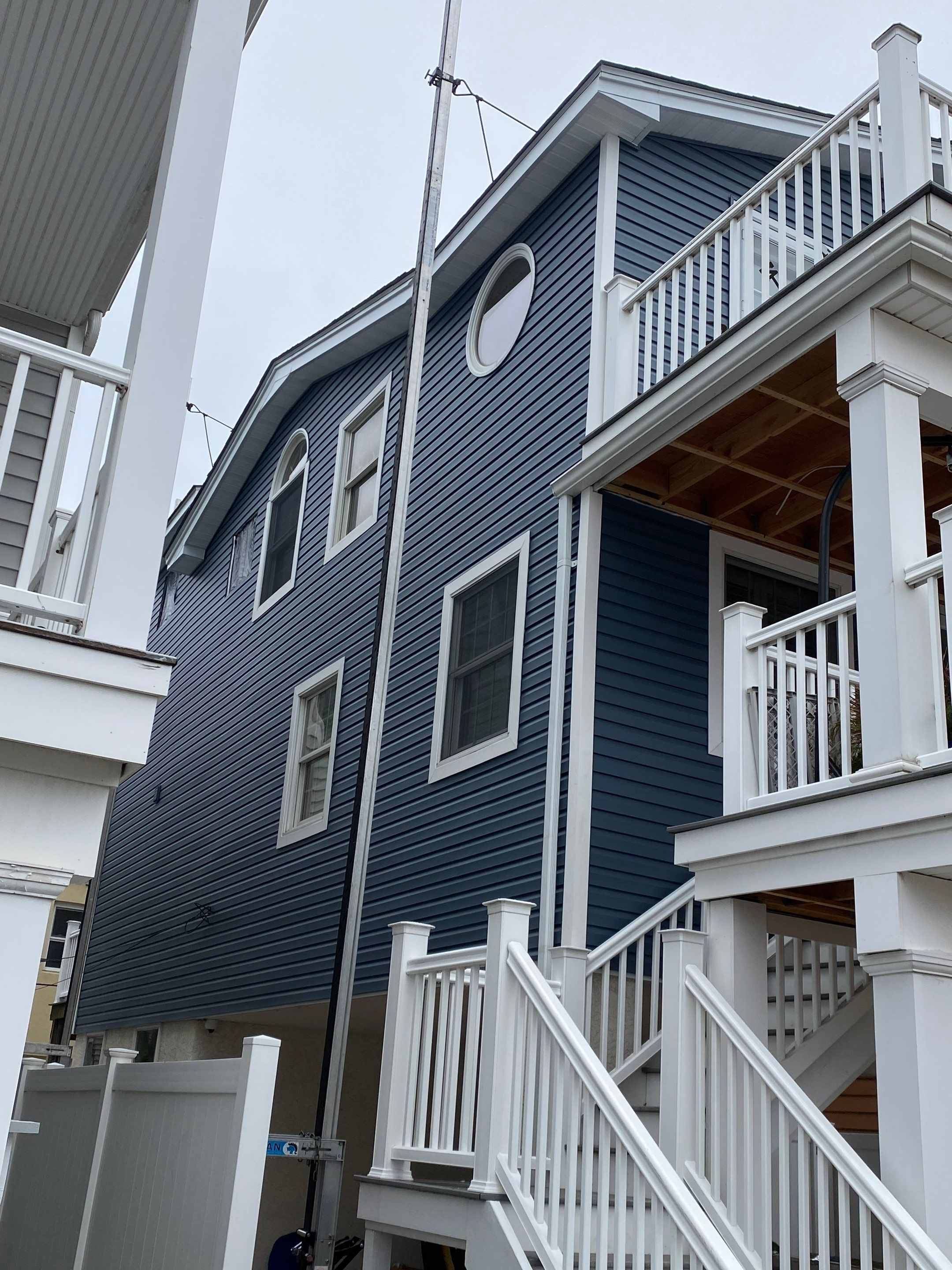 House lift in the westend of Long Beach. by Above All Gutters