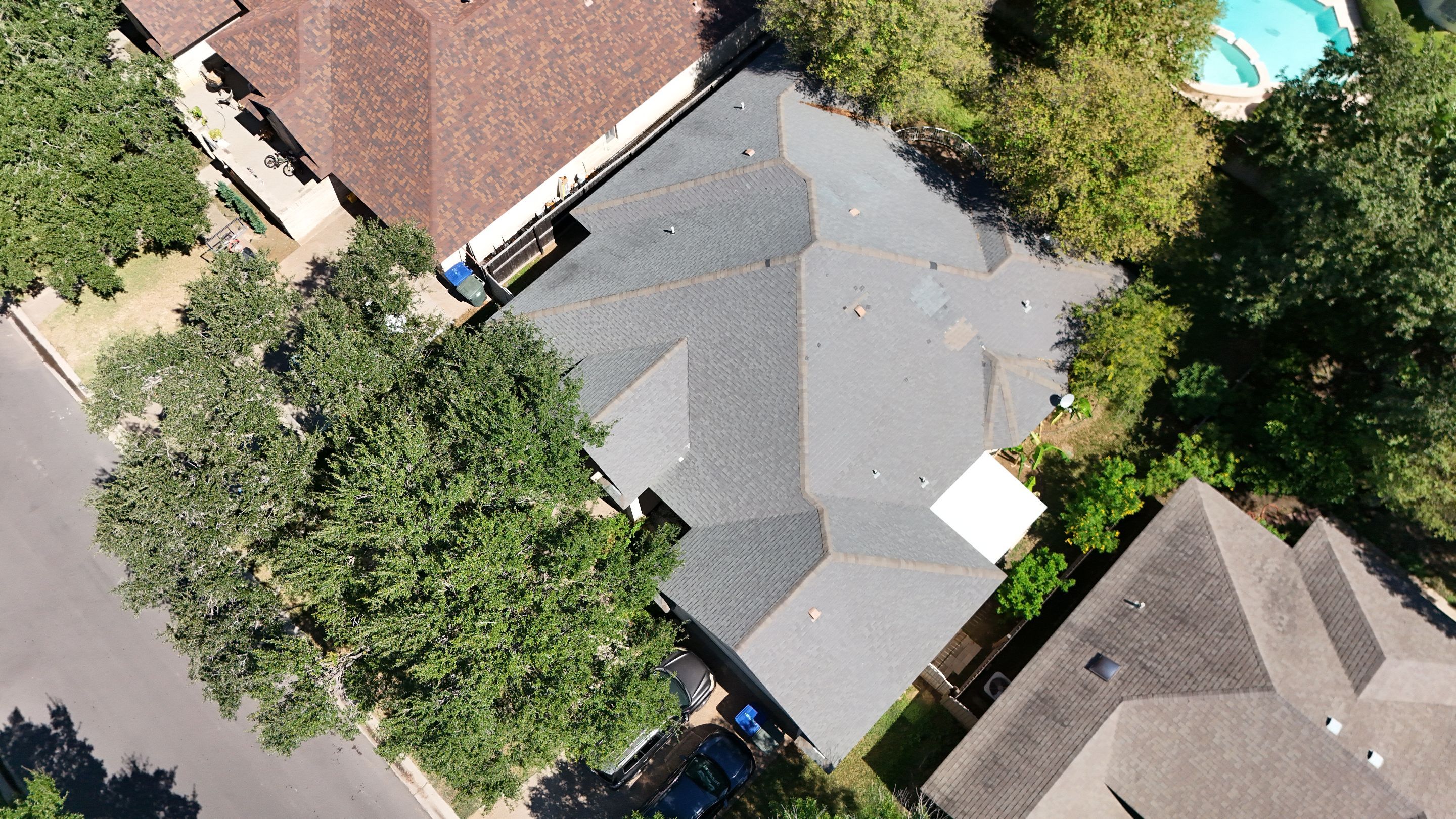 Residential Roof Replacement with Gray Composite Asphalt Shingles in Laredo by JM Flores Roofing & Construction, Inc