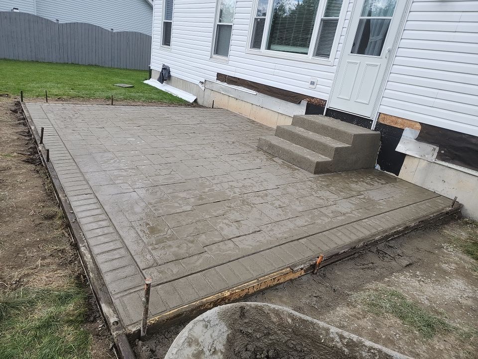 Stamped Concrete and Entry Door by Ivy Lea Construction