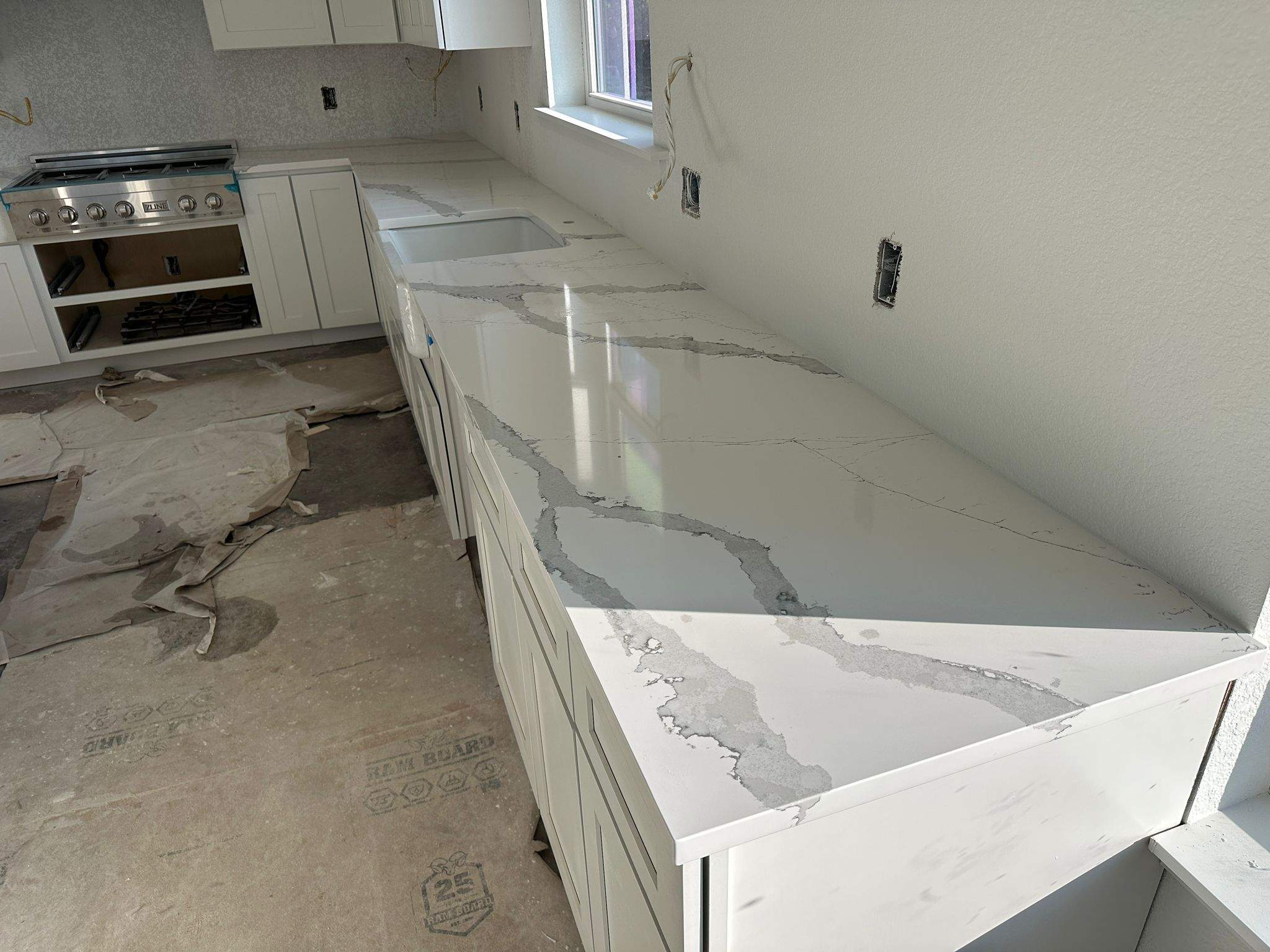 Kitchen and Bathroom Countertop Upgrades Featuring Gray Veined Quartz by Mena stone surfaces
