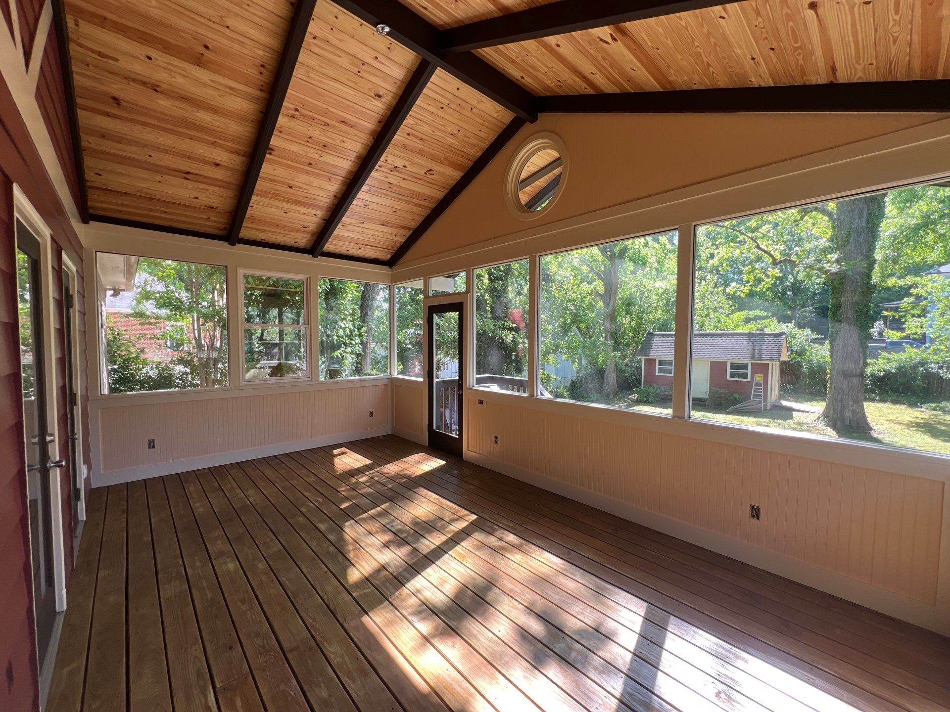 Elevated Screened-In Porch Addition with Vaulted Tongue-and-Groove Ceiling by Swift Home Renovations