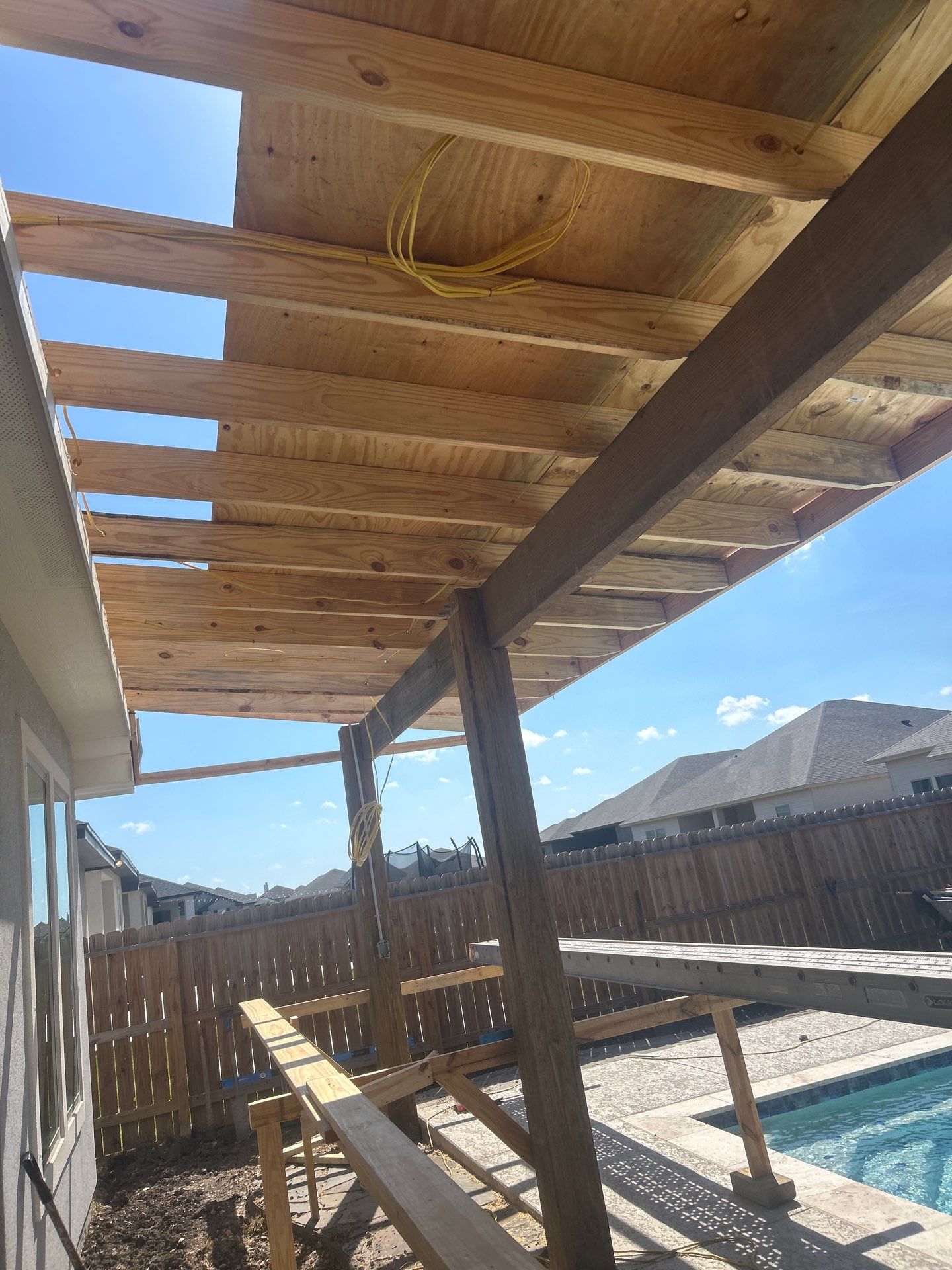 Patio Pool Cover by Bayfront Roofing and Construction