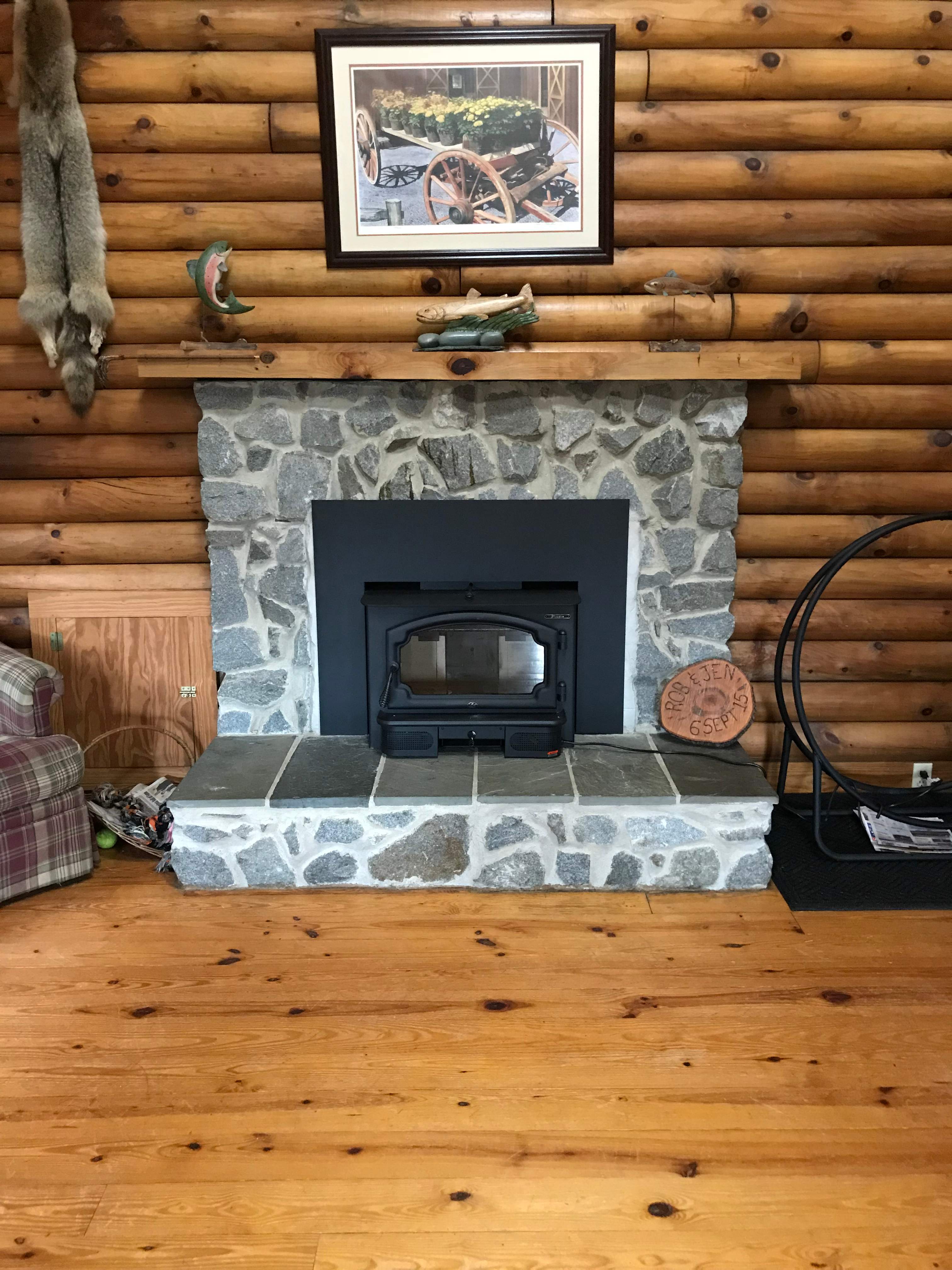 Wood Stove Insert + Stone + Mantel by Premier Chimney and Roofing