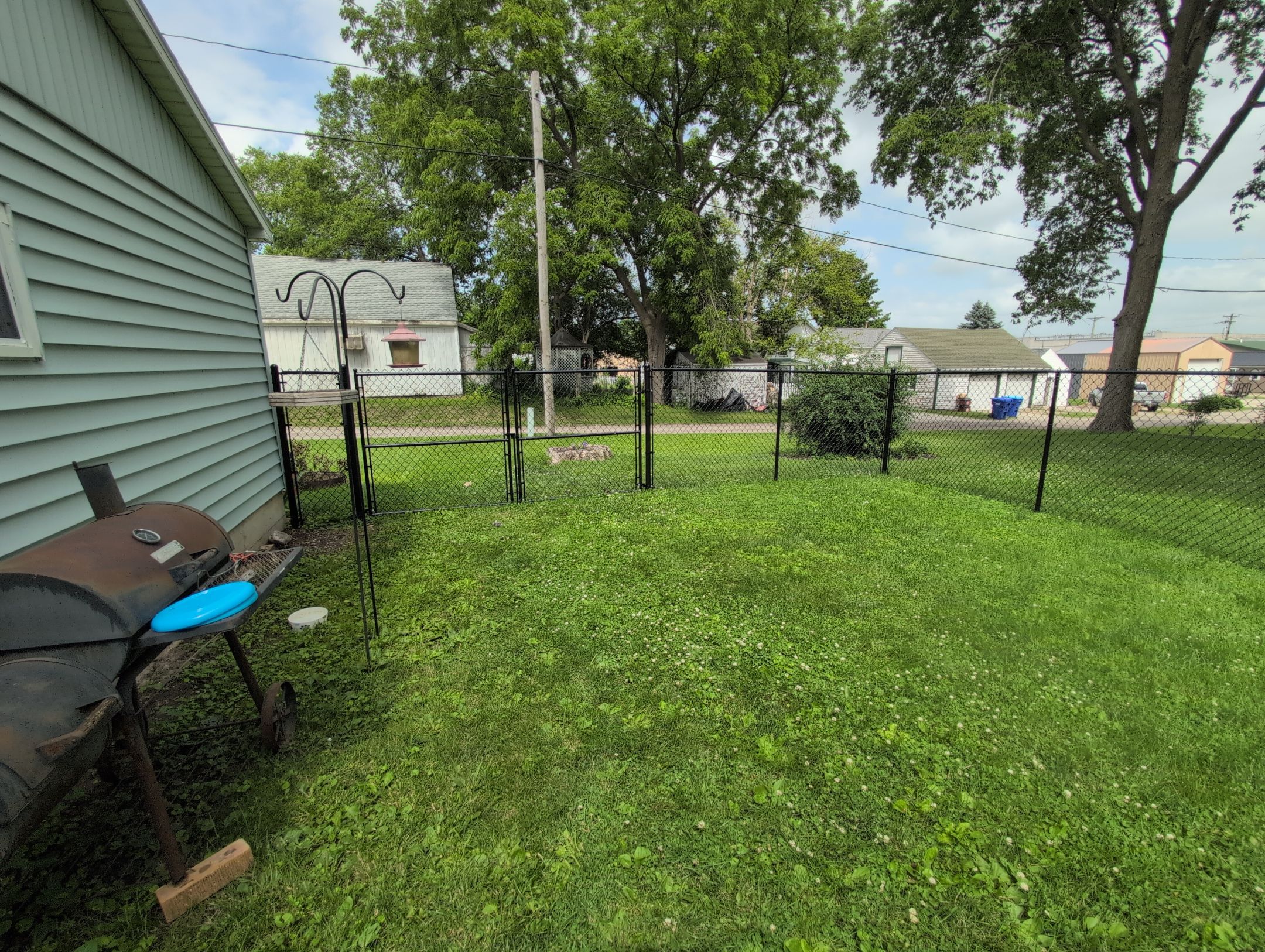 Black Vinyl Coated Chain Link Fence Installation in Independence by Perfect Picket Fence and Stain