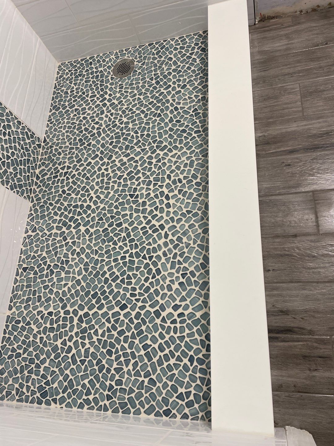 Sleek bathroom shower remodel by Footprints Floors of East Atlanta