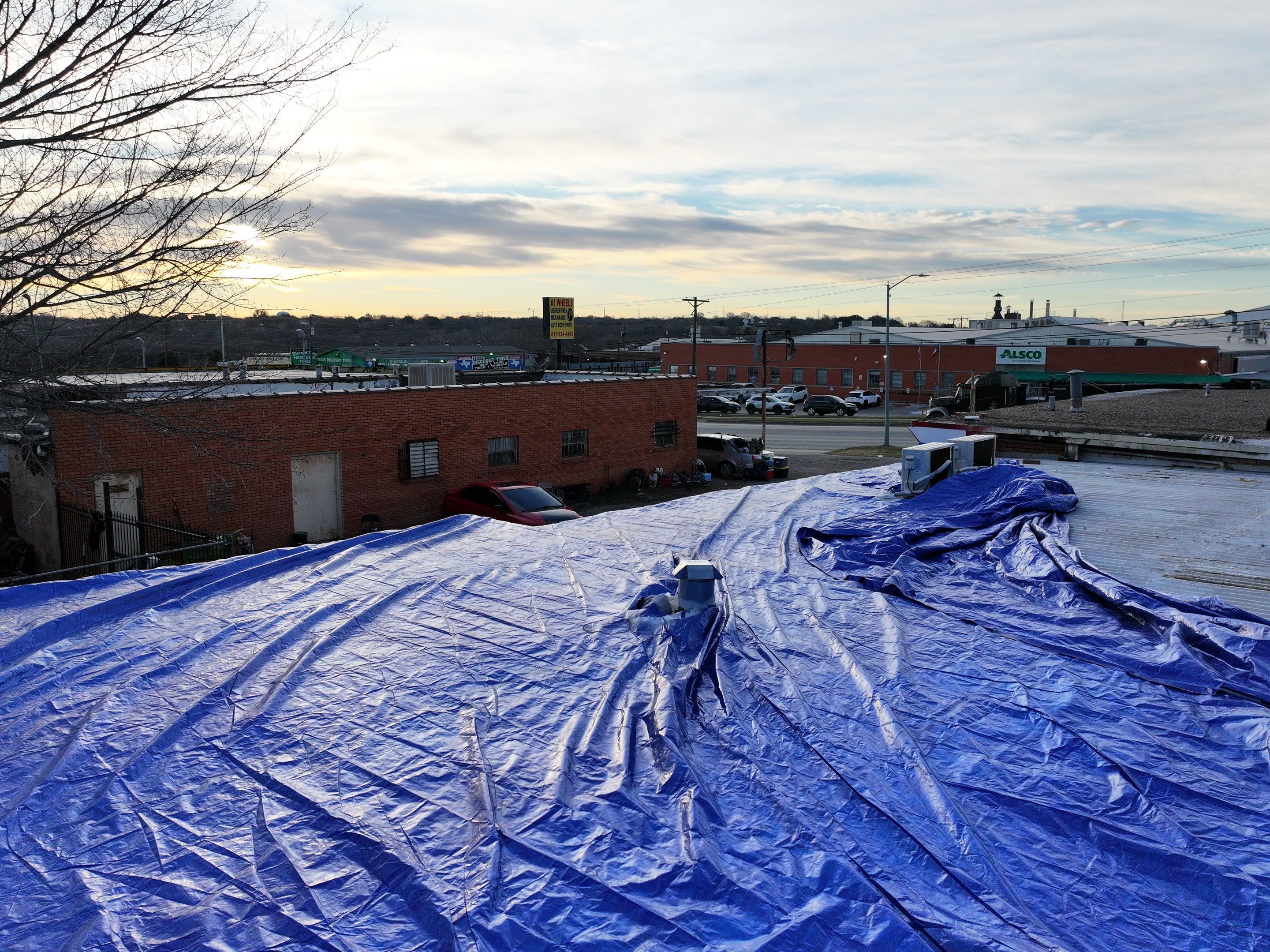 Commercial roofing overlay using GAF TPO over an old ballast roof by Becker Roofing and Exteriors