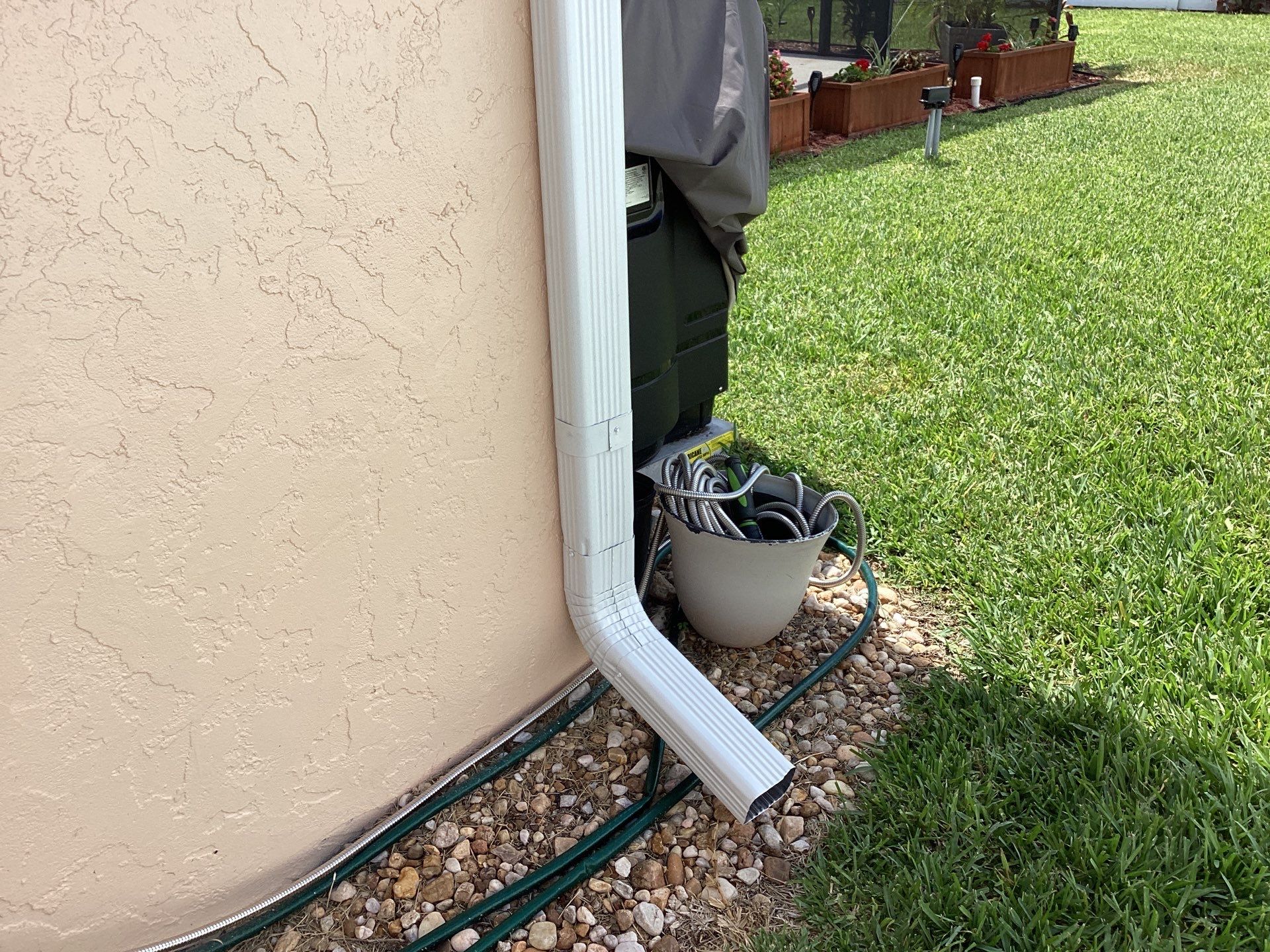 White K Style Seamless Gutters using 3X4 Elbow Downspout in Cape Coral FL by Gutter Professors