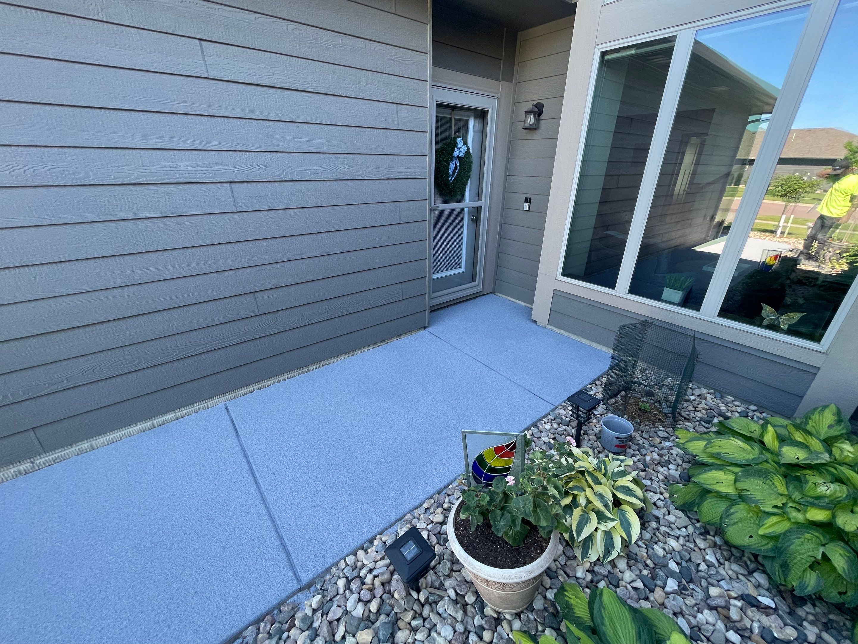 Custom Concrete Coating for Sioux Falls Patio and Front Walkway by Select Painting, Coatings & Garage Cabinets