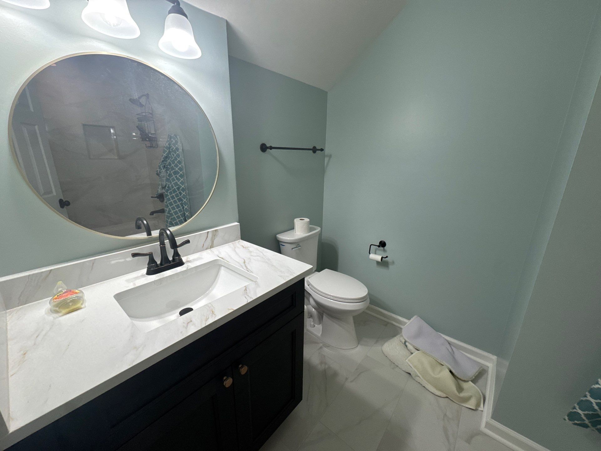 Modern Bathroom Transformation With Marble Patterned Tile in Powder Springs by Swift Home Renovations