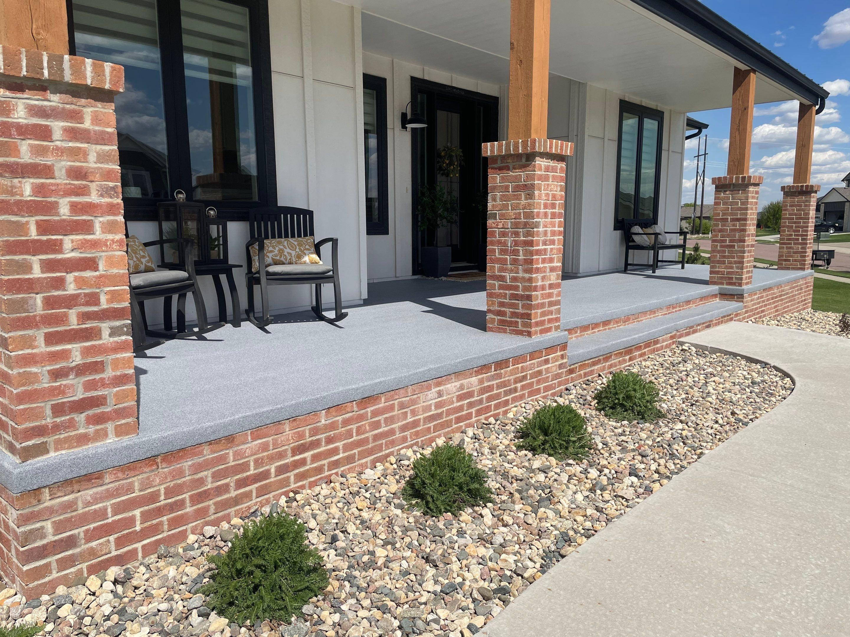 Grey Speckled Concrete Porch Coating for Sioux Falls Home by Select Painting, Coatings & Garage Cabinets