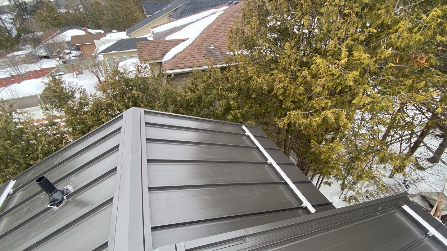 Residential Roofing Installation using 16" Standing Seam Panels by Jay Carter Roofing & Sheet Metal