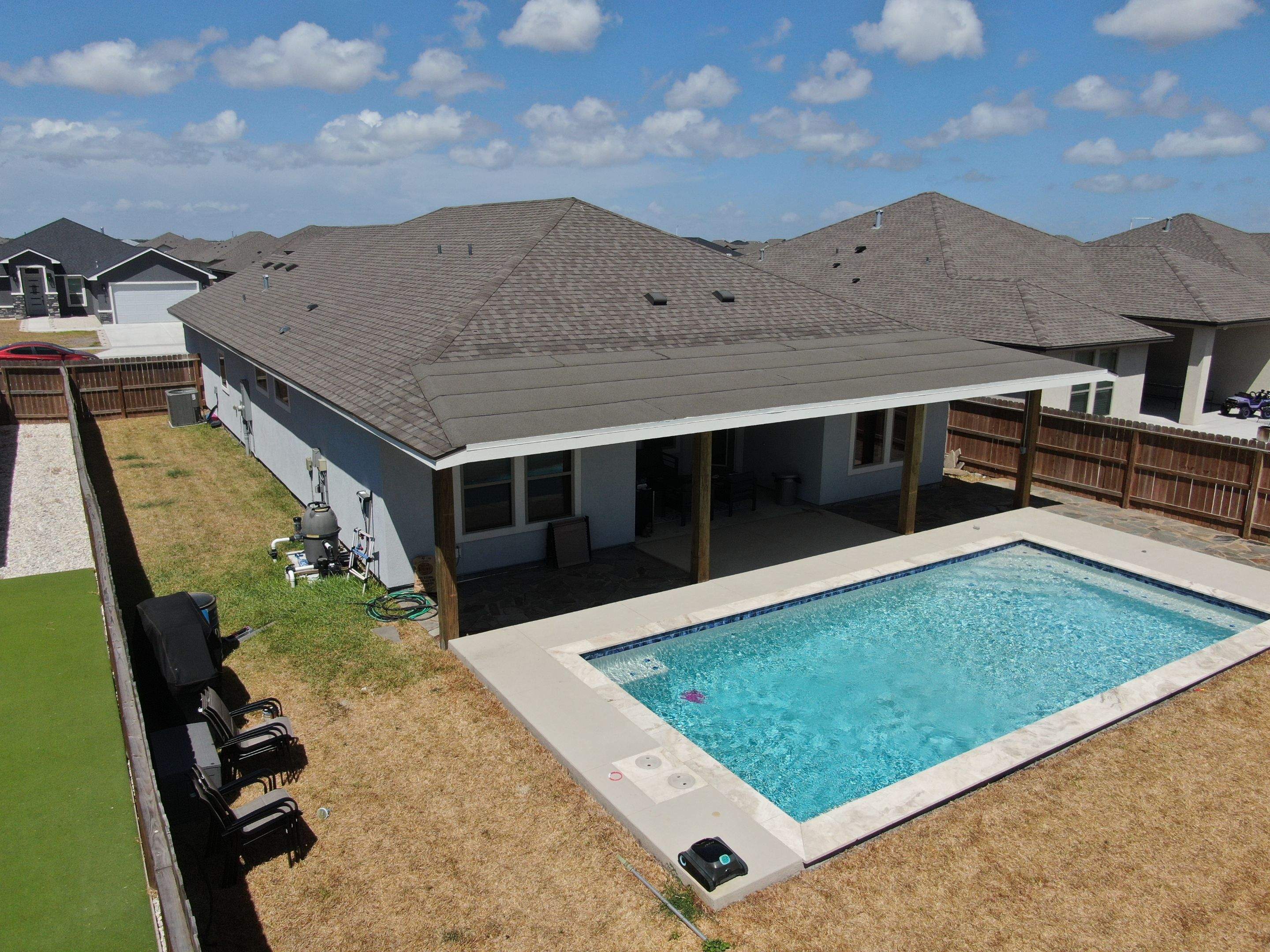 Patio Pool Cover by Bayfront Roofing and Construction