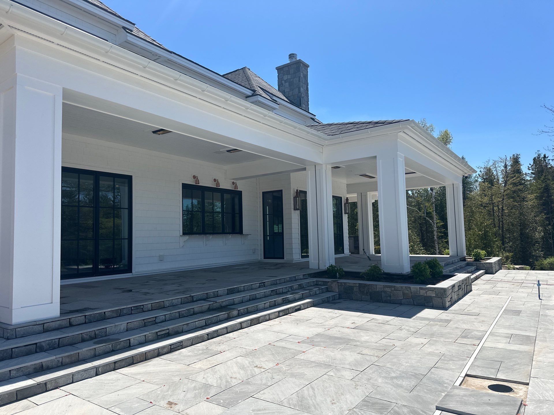 Gutter System and Exterior Drainage Installation in Charlevoix by Rainbow Seamless Systems