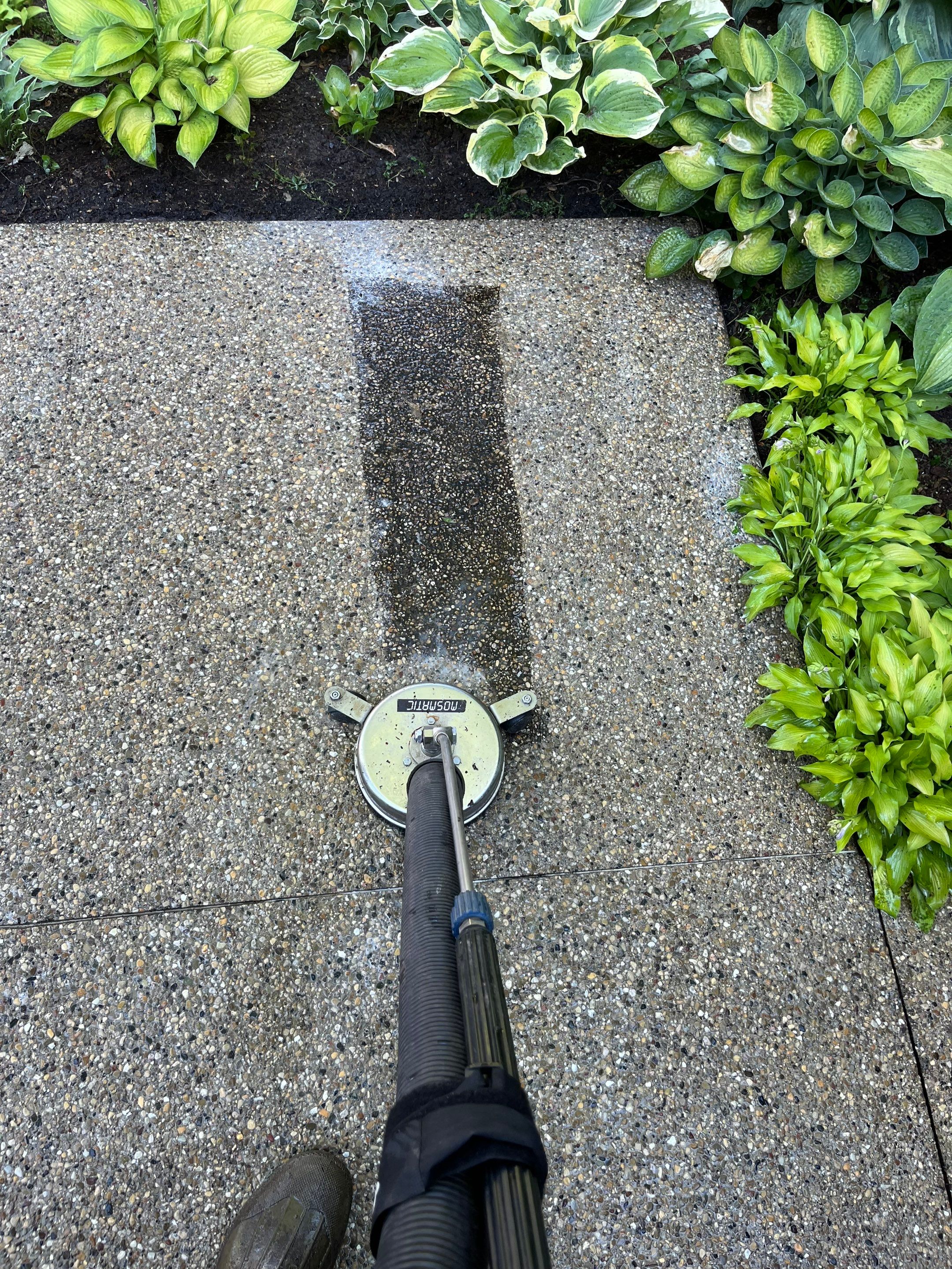 Aggregate concrete cleaning and sealing using Surebond SB-9000 by Northern Power Washing LLC.