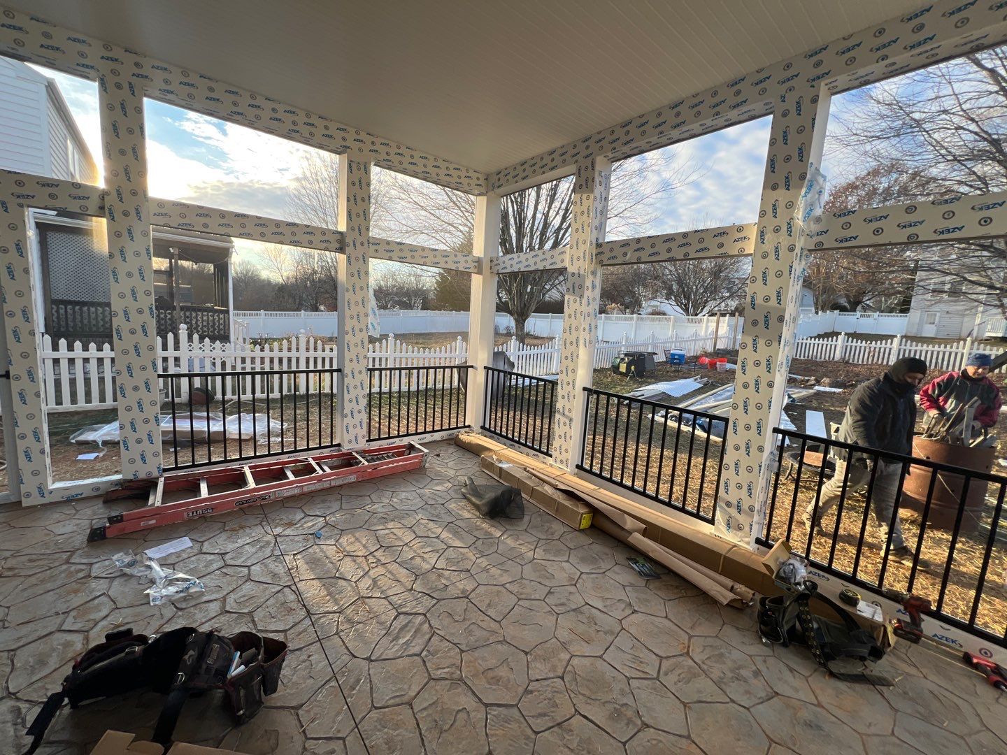 Custom Screened-In Porch with Stamped Concrete Patio in Warrenton by Jakari Restoration & Construction LLC