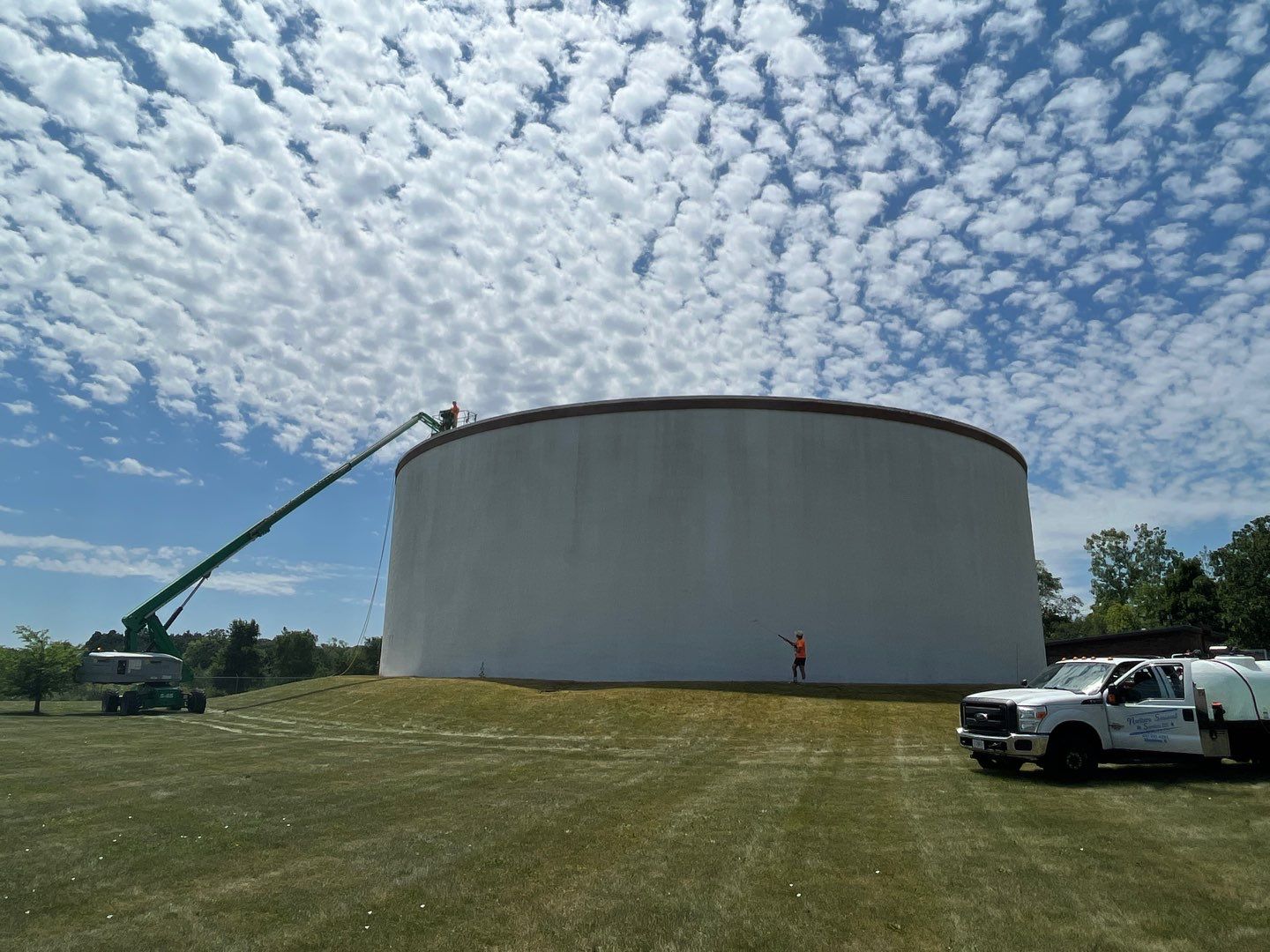 Water tank cleaning by Northern Power Washing LLC.