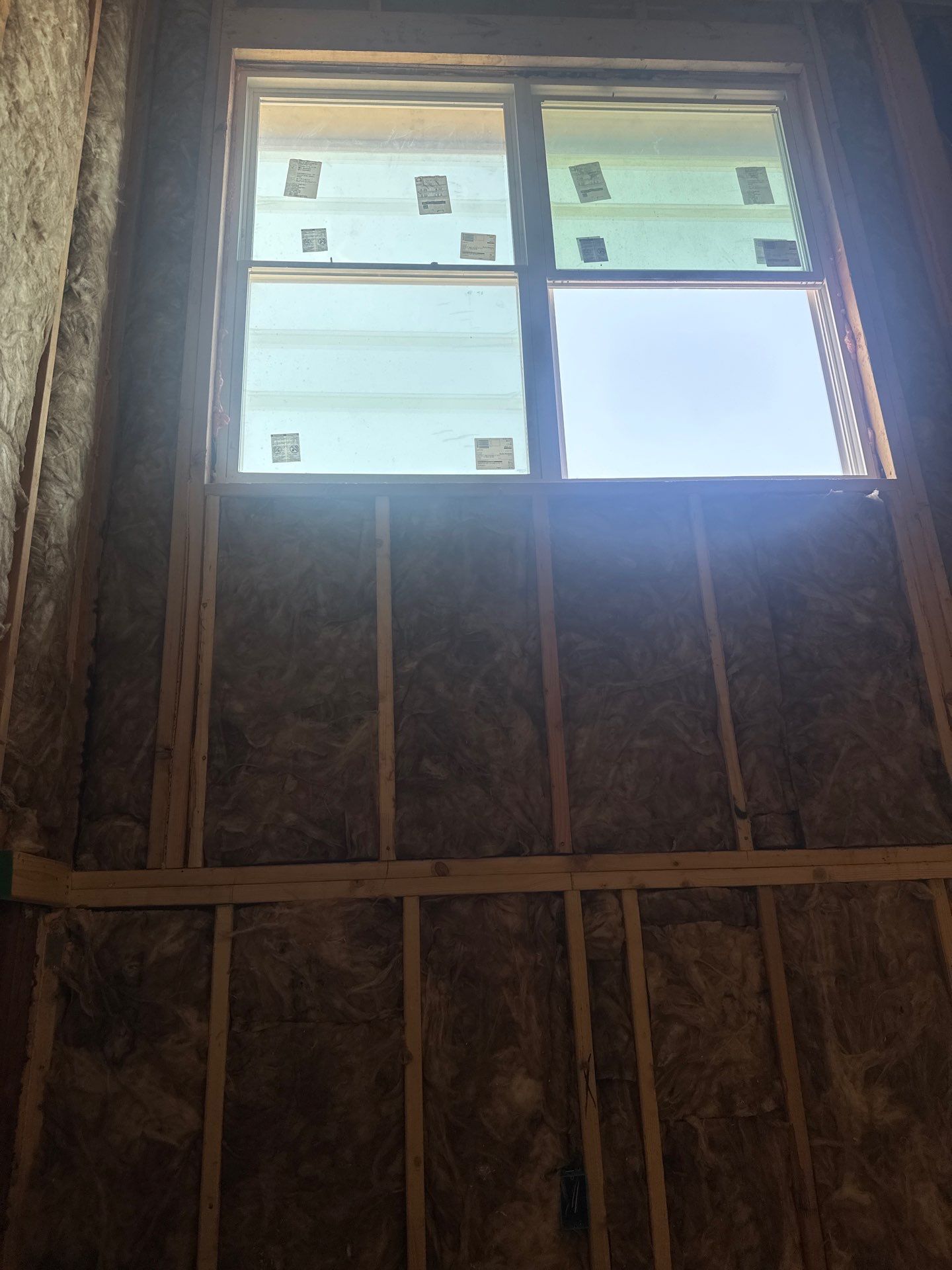 Fiberglass batt install on a second story addition in Dallas by Apex Insulation Solutions