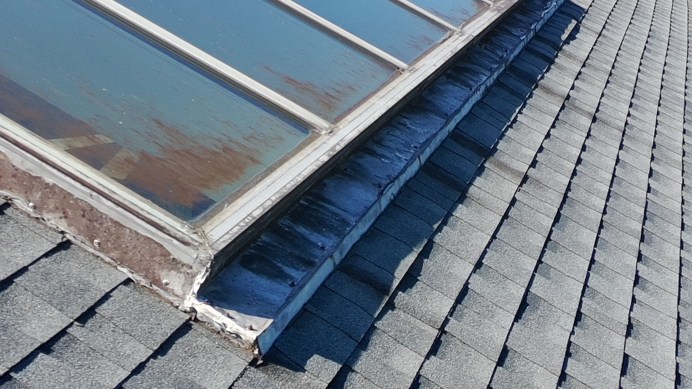 Ridge Skylight Repair and Shingle Roof Maintenance in Winter Park by Fortified Roofing Solutions Corp.